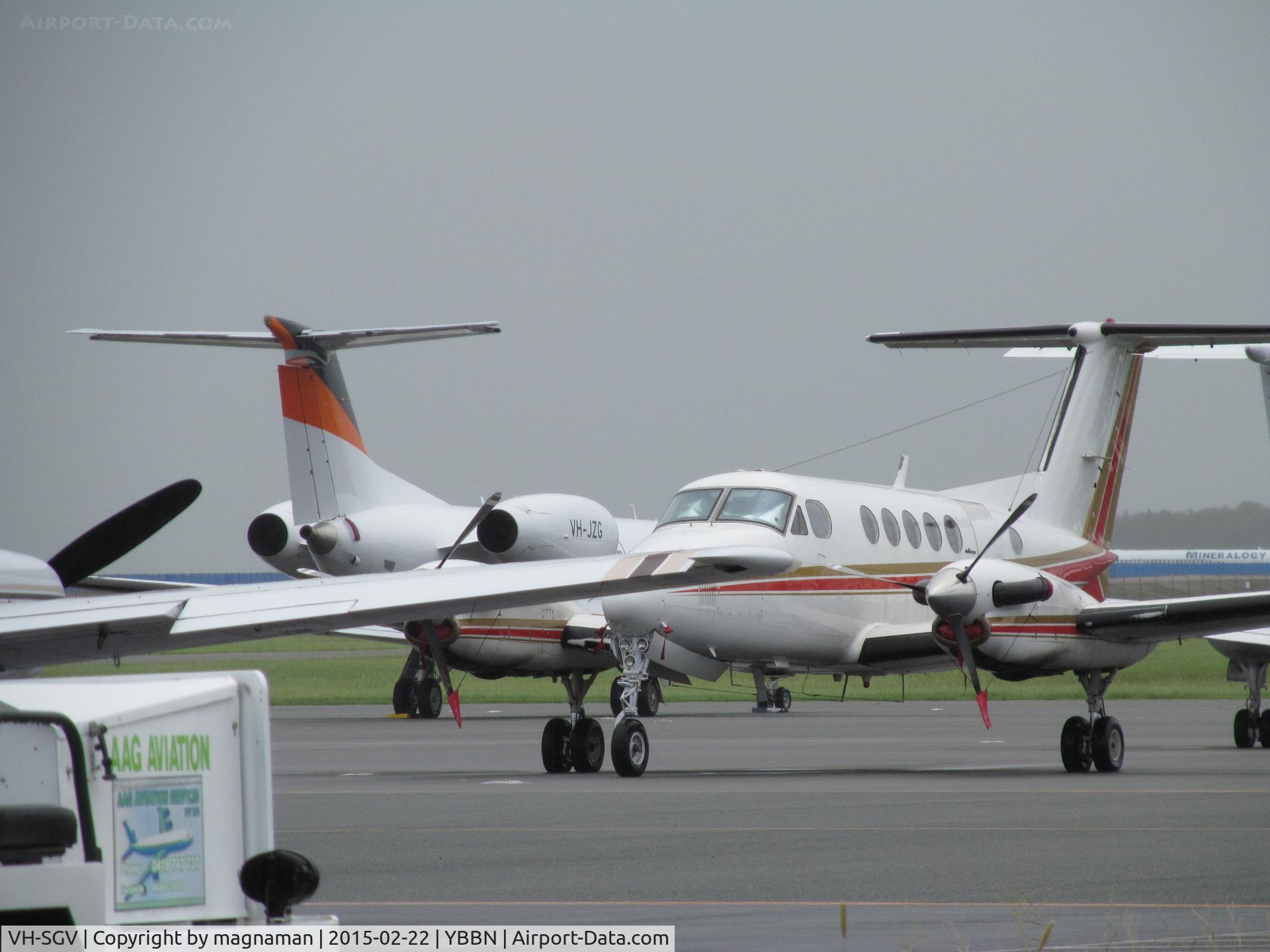 VH-SGV, 1980 Beech 200 King Air C/N BB-718, on crowded GA apron with VH-JZG in background and slim view of VP-CBH stored MD81 (Mineralogy)