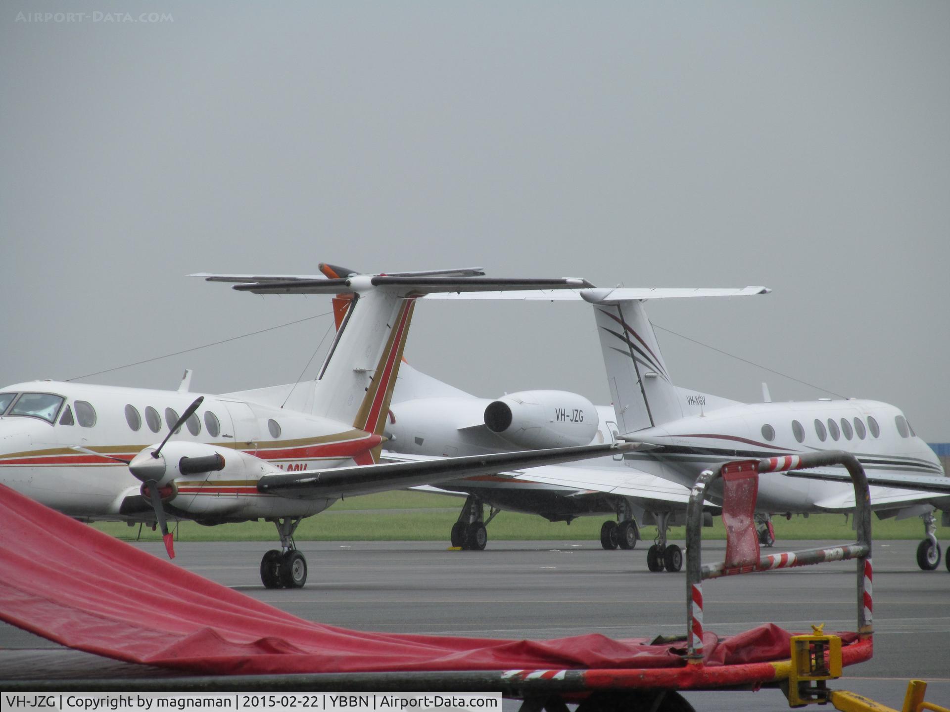 VH-JZG, 1989 Robinson R22 BETA C/N 1115, Not a robinson!!! ERJ-135 c/n 145713 one of two on GA ramp