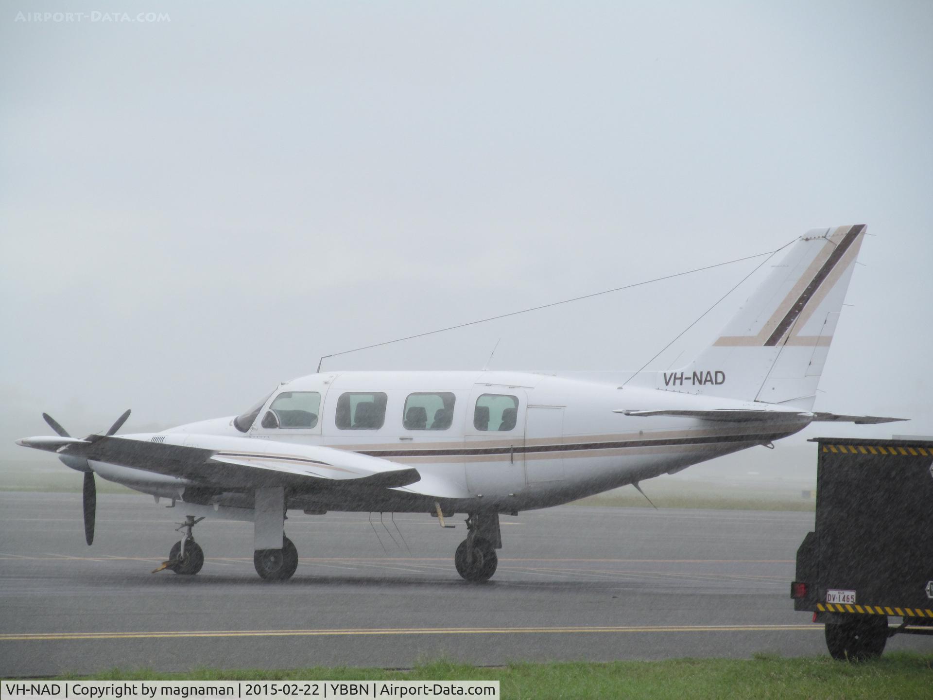 VH-NAD, 1981 Piper PA-31 Navajo C/N 31-8212004, on GA ramp in cloud burst