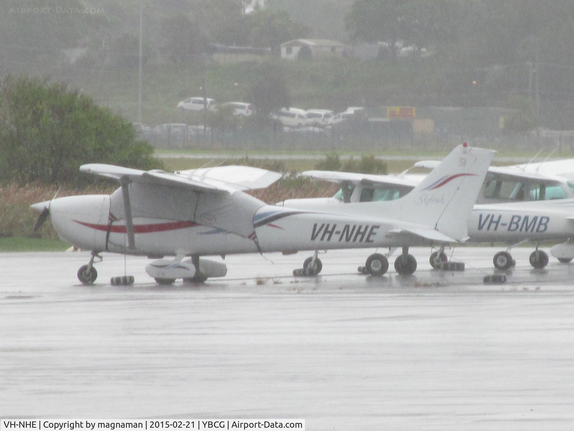 VH-NHE, Cessna 172 C/N 172-80920, on a very wet GA ramp