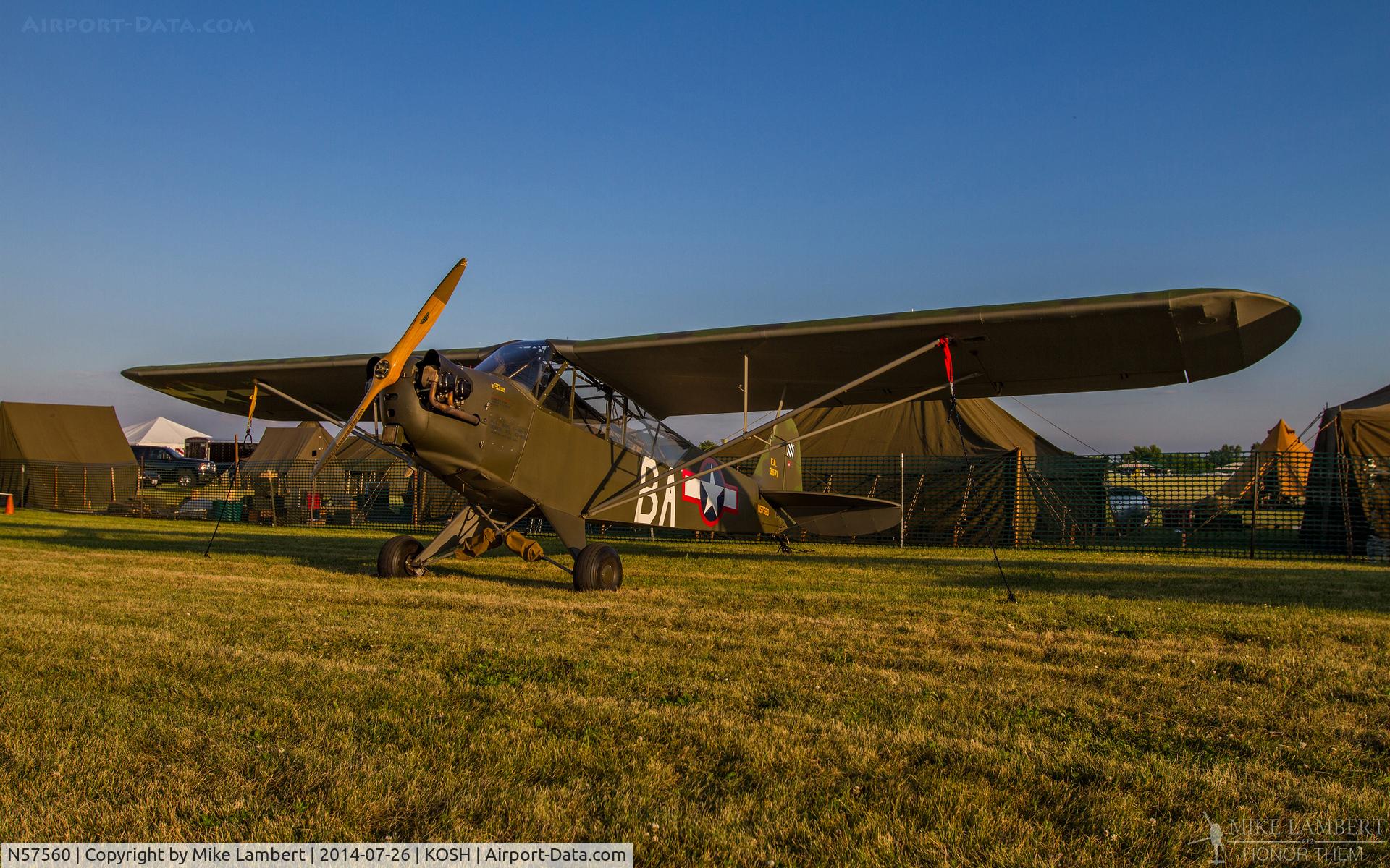 N57560, 1943 Piper J3C-65 Cub C/N 10146, ’43 J-3C sitting in the Warbird Liaison/Observation ramp at Oshkosh 2014.