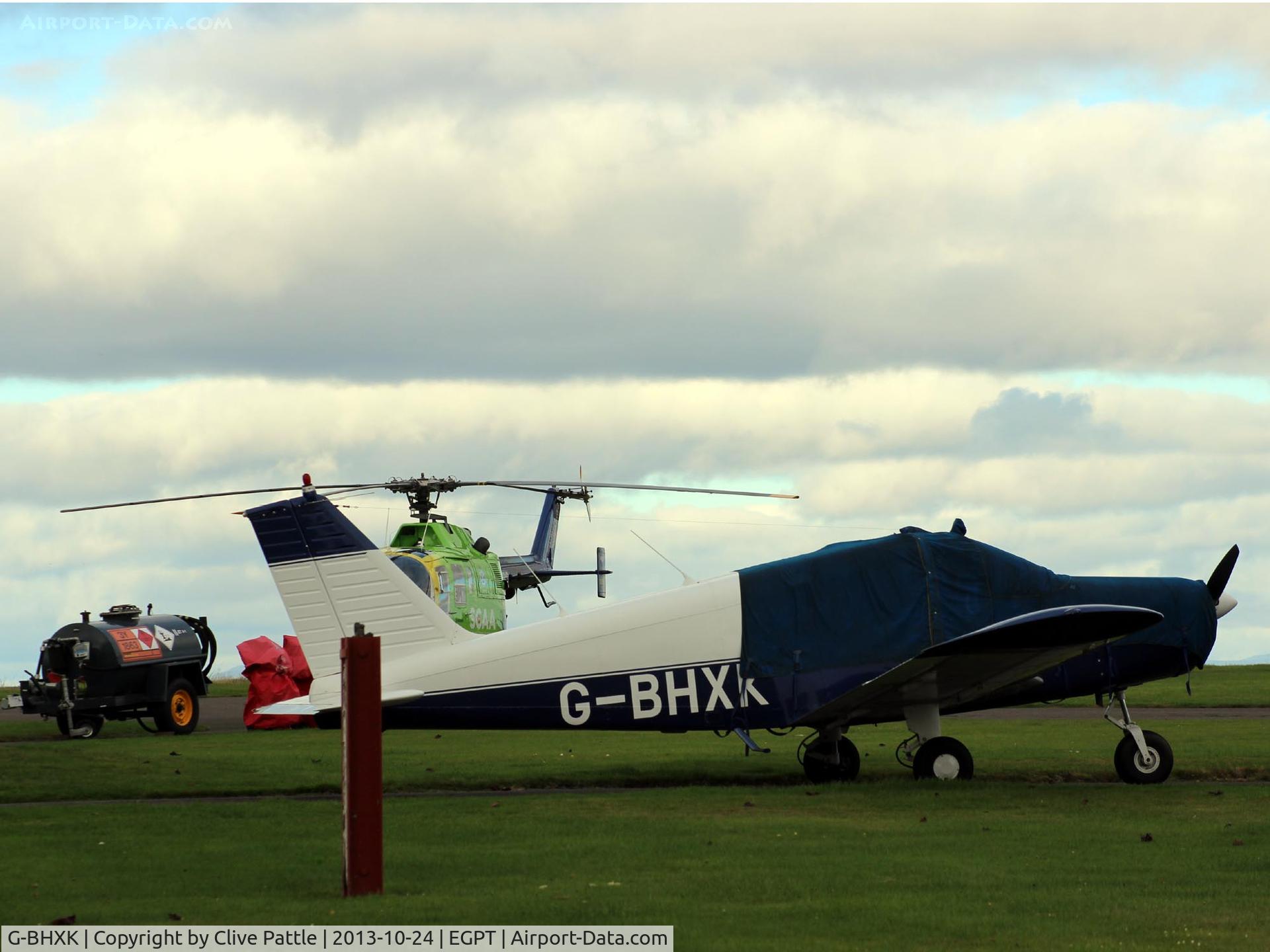 G-BHXK, 1965 Piper PA-28-140 Cherokee C/N 28-21106, Awaiting their next sorties from the grass at Perth EGPT. Sadly this aircraft crashed 05-04-15 near Oban, Scotland with two fatalities. RIP.