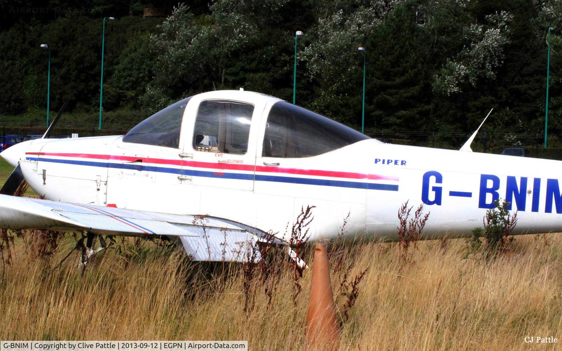 G-BNIM, 1978 Piper PA-38-112 Tomahawk Tomahawk C/N 38-78A0148, A dead Tomahawk in the graveyard on the eastern side of Dundee Riverside airport EGPN