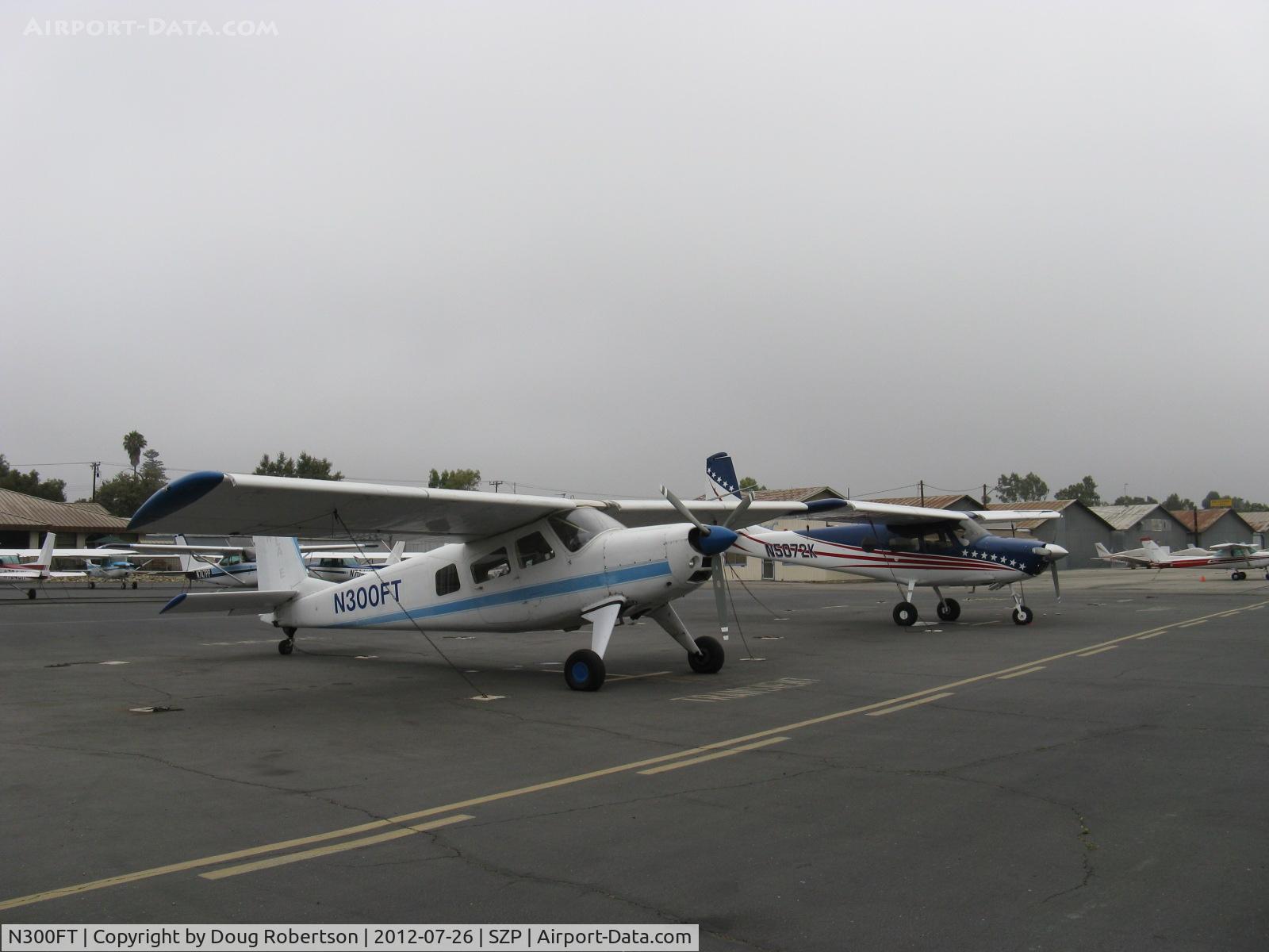 N300FT, 1971 Helio H-295-1400 Super Courier C/N 1440, Two Helio H-295 SUPER COURIER STOL aircraft; one converted to HT-295 tri-gear. N300FT is a 1971 H-295, N5072K behind is a 1967 converted to HT-295. Unusual pair seen together.