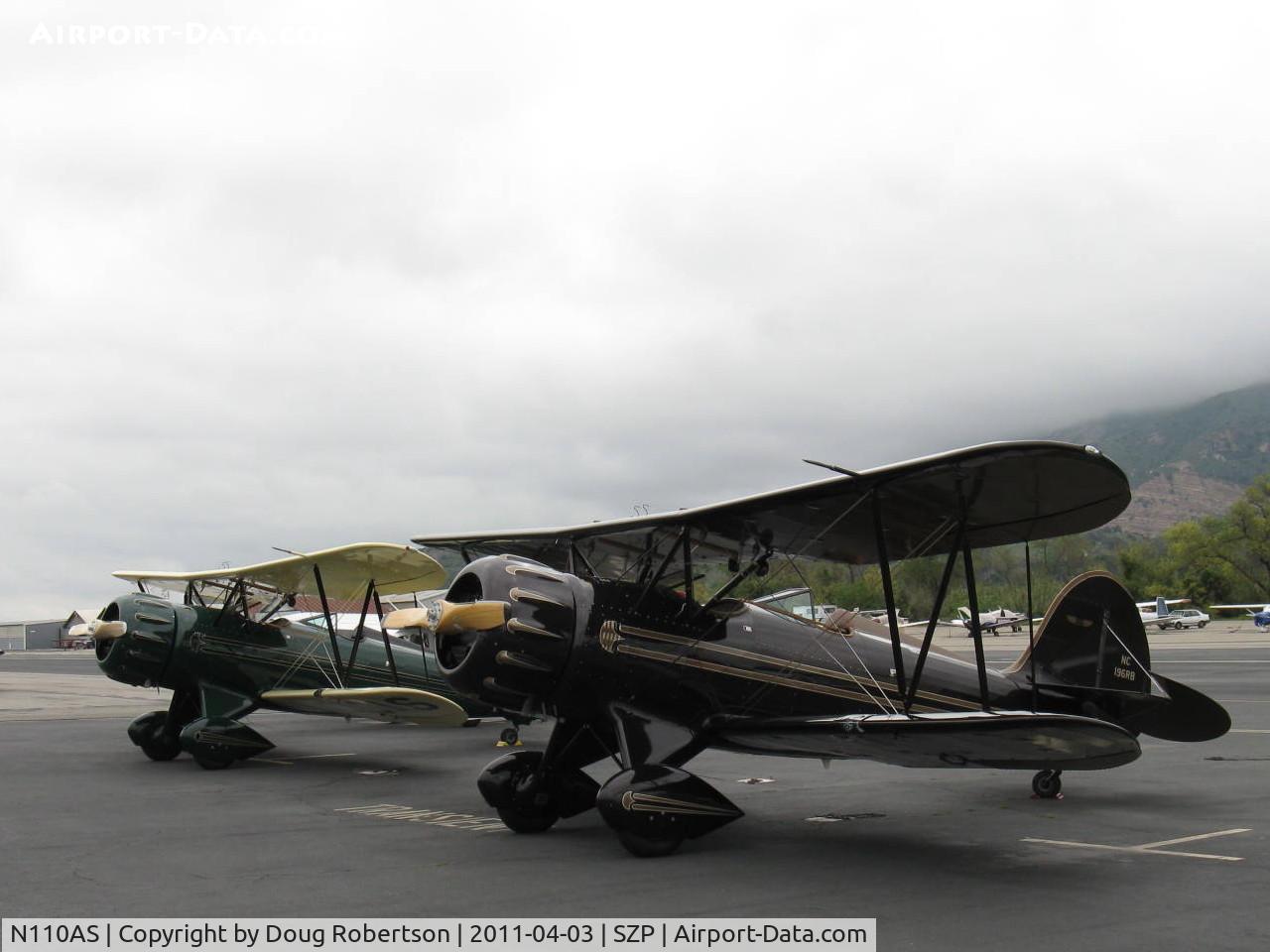 N110AS, 2005 Waco YMF-F5C C/N F5C110, A pair of WACO Classic YMF-F5Cs parked on the transient line on First Sunday Aviation Museum of Santa Paula Open House & Fly-In. N110AS & N196RB.