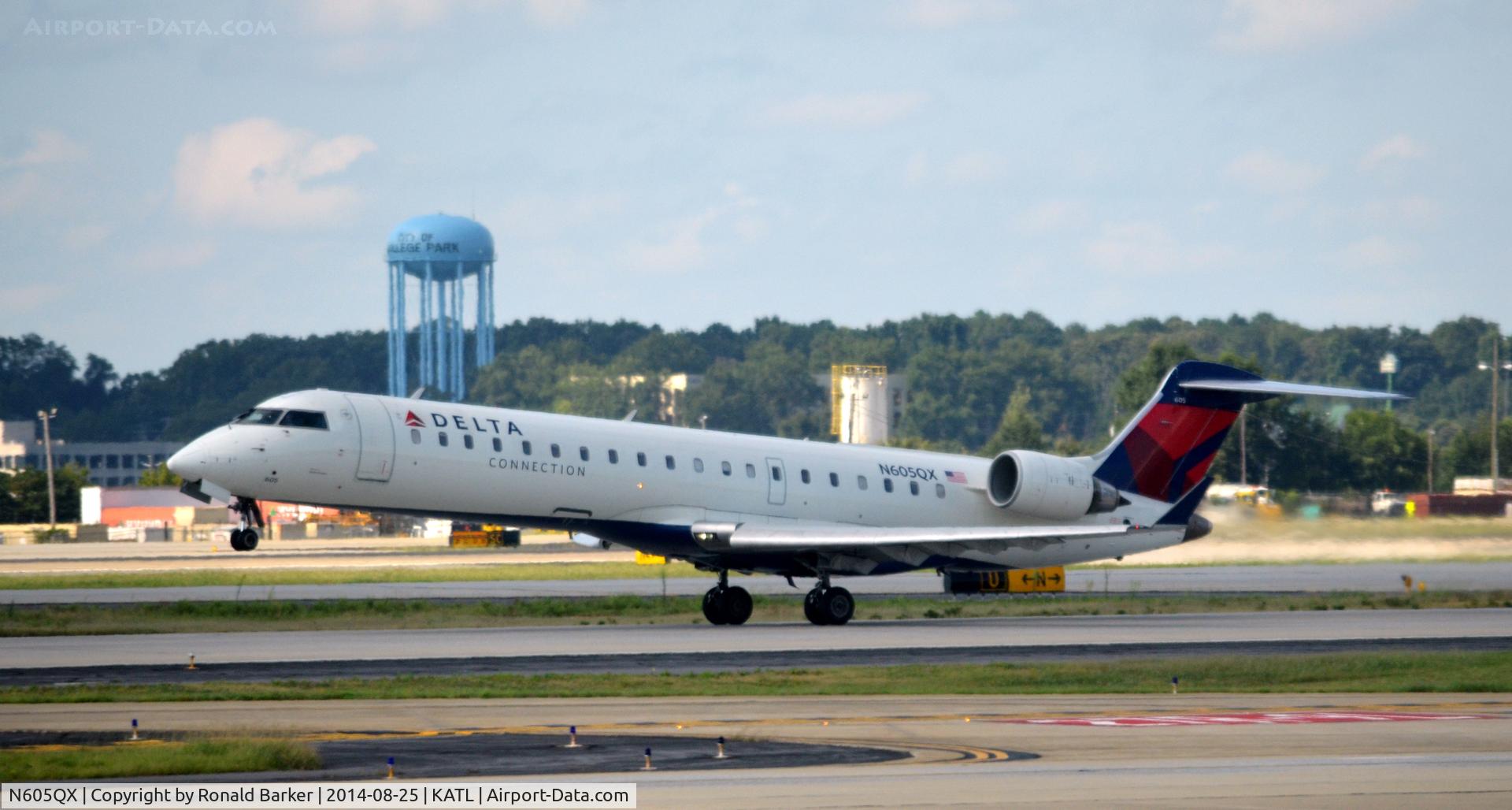 N605QX, 2002 Bombardier CRJ-701 (CL-600-2C10) Regional Jet C/N 10022, Nose wheel liftoff Atlanta