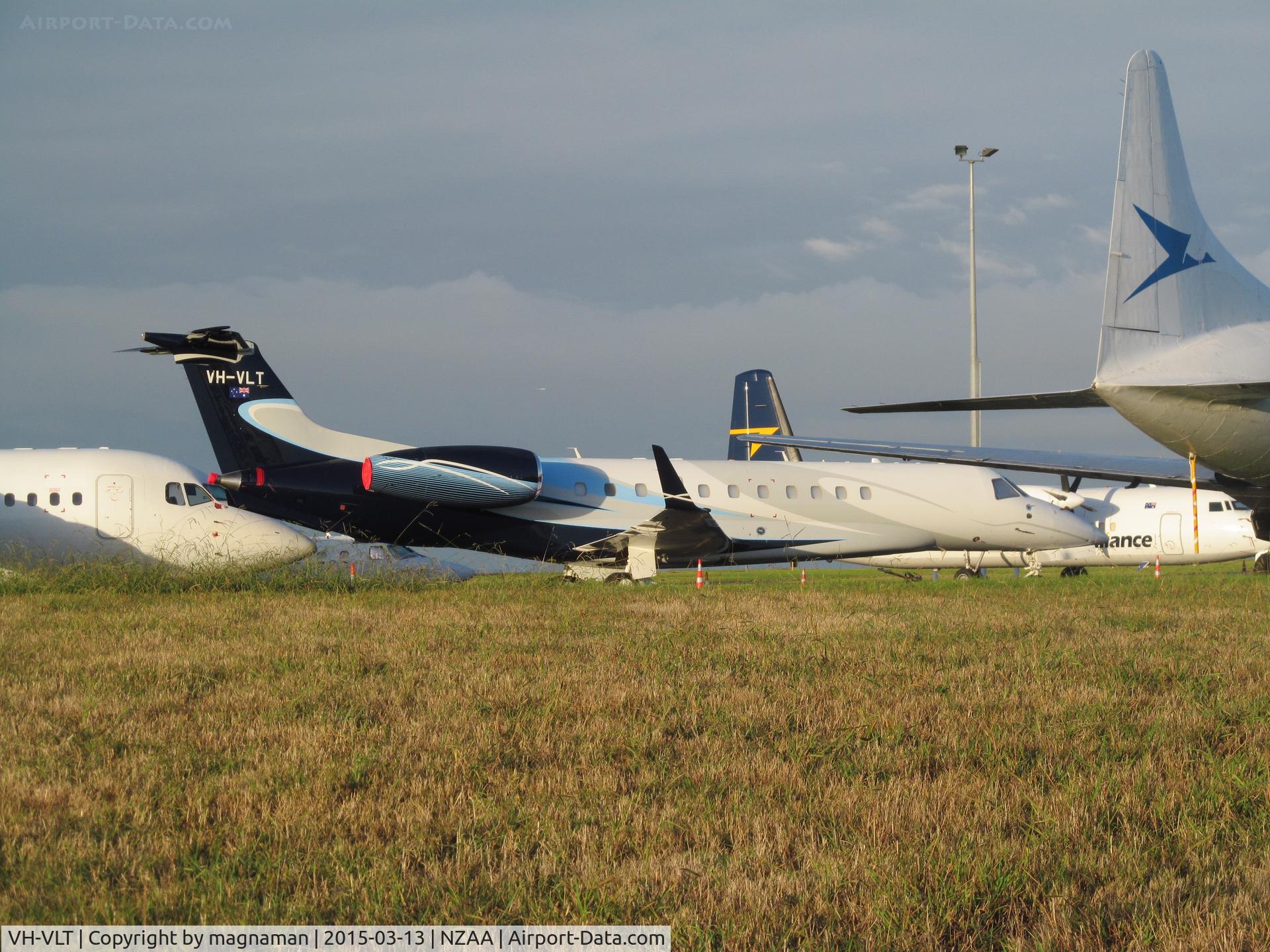 VH-VLT, 2010 Embraer EMB-135BJ Legacy C/N 14501107, regular visitor to NZ but my first photo. On crowded convair apron.