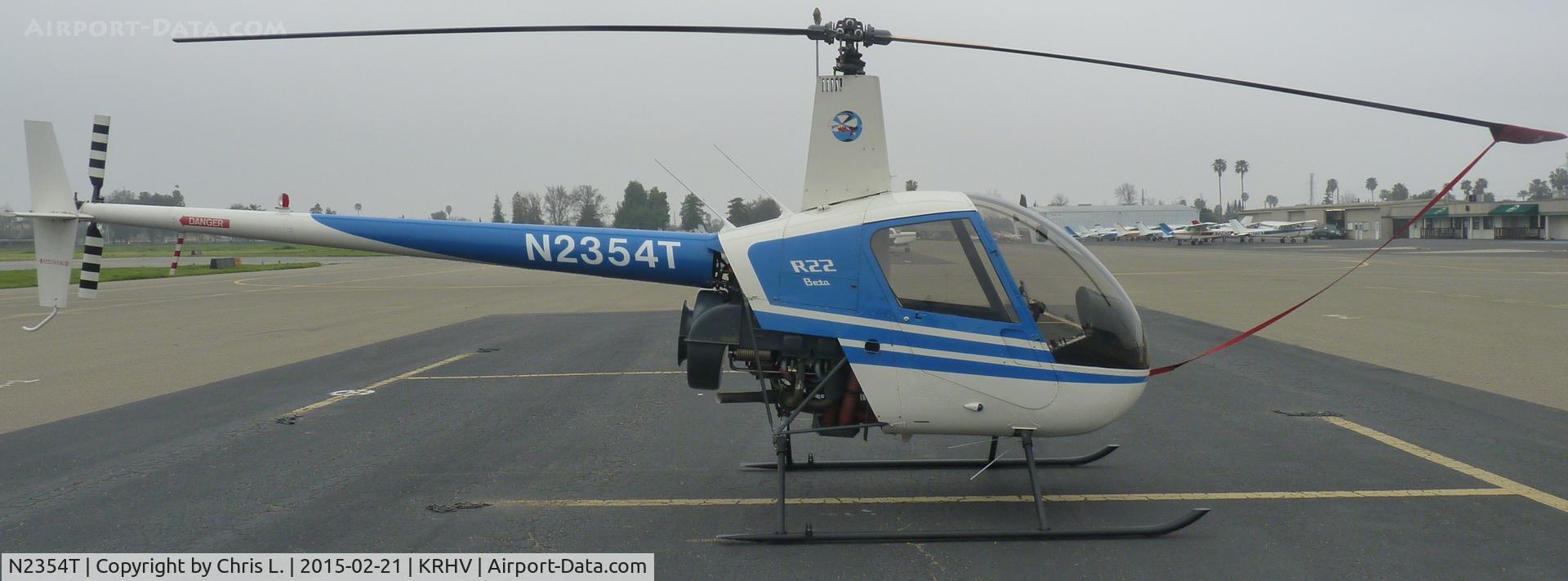 N2354T, 1992 Robinson R22 Beta C/N 2247, A transient 1992 Robinson R22 Beta sits at the transient ramp on a very overcast morning at Reid-Hillview.