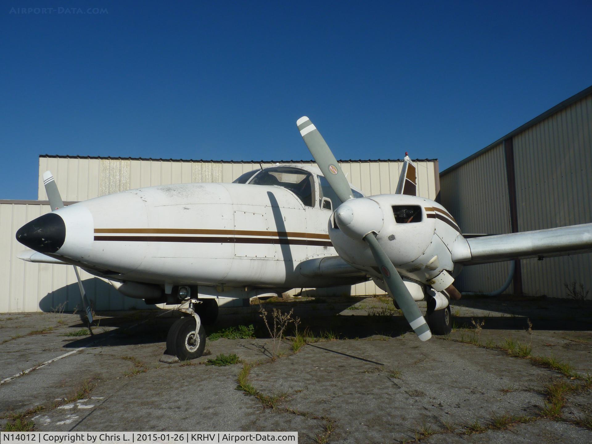 N14012, 1971 Piper PA-23-250 Aztec C/N 27-4629, An old local Piper Aztec sits next to one of the T hangars at Reid Hillview. Believe it or not, this plane actually flies every once in a while. It's used for air photography.