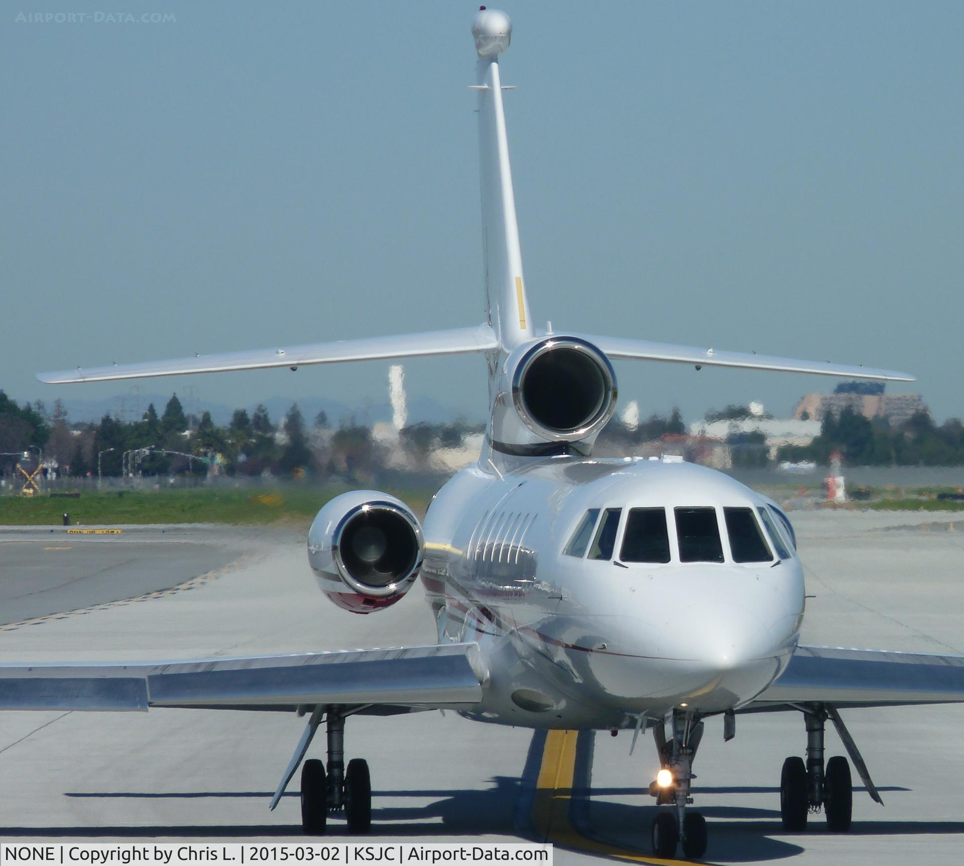 N566LD, 1965 Mooney M20E C/N 689, A Falcon 50 taxing for departure out of San Jose International Airport.