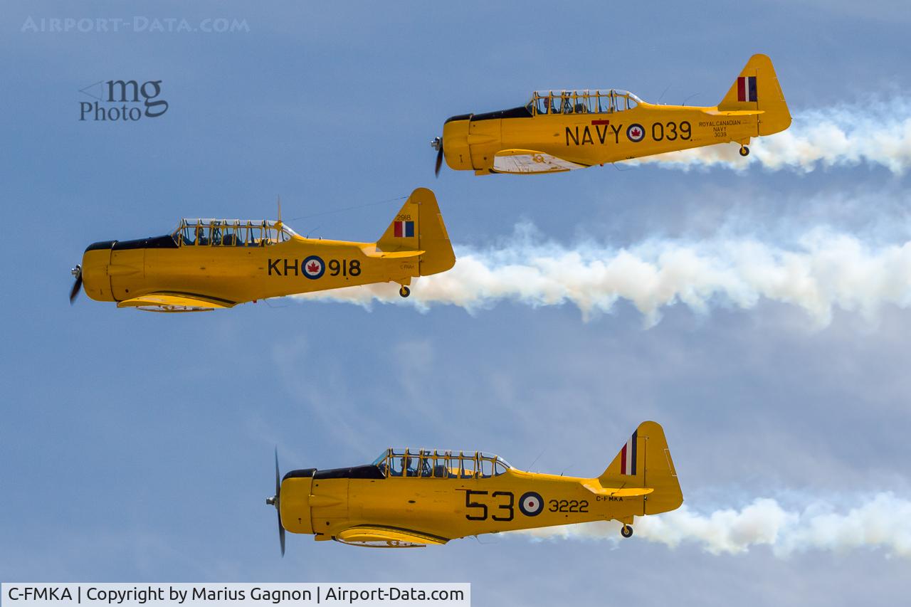 C-FMKA, 1941 Noorduyn AT-16 Harvard II C/N 75-3496, C-FMKA in formation, flying beside C-FNAH and C-FNDB on her right.