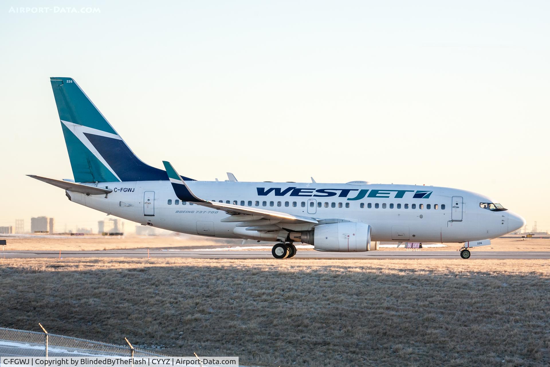 C-FGWJ, 2004 Boeing 737-7CT C/N 32764, Holding short of 06L prior to departure from Toronto Pearson