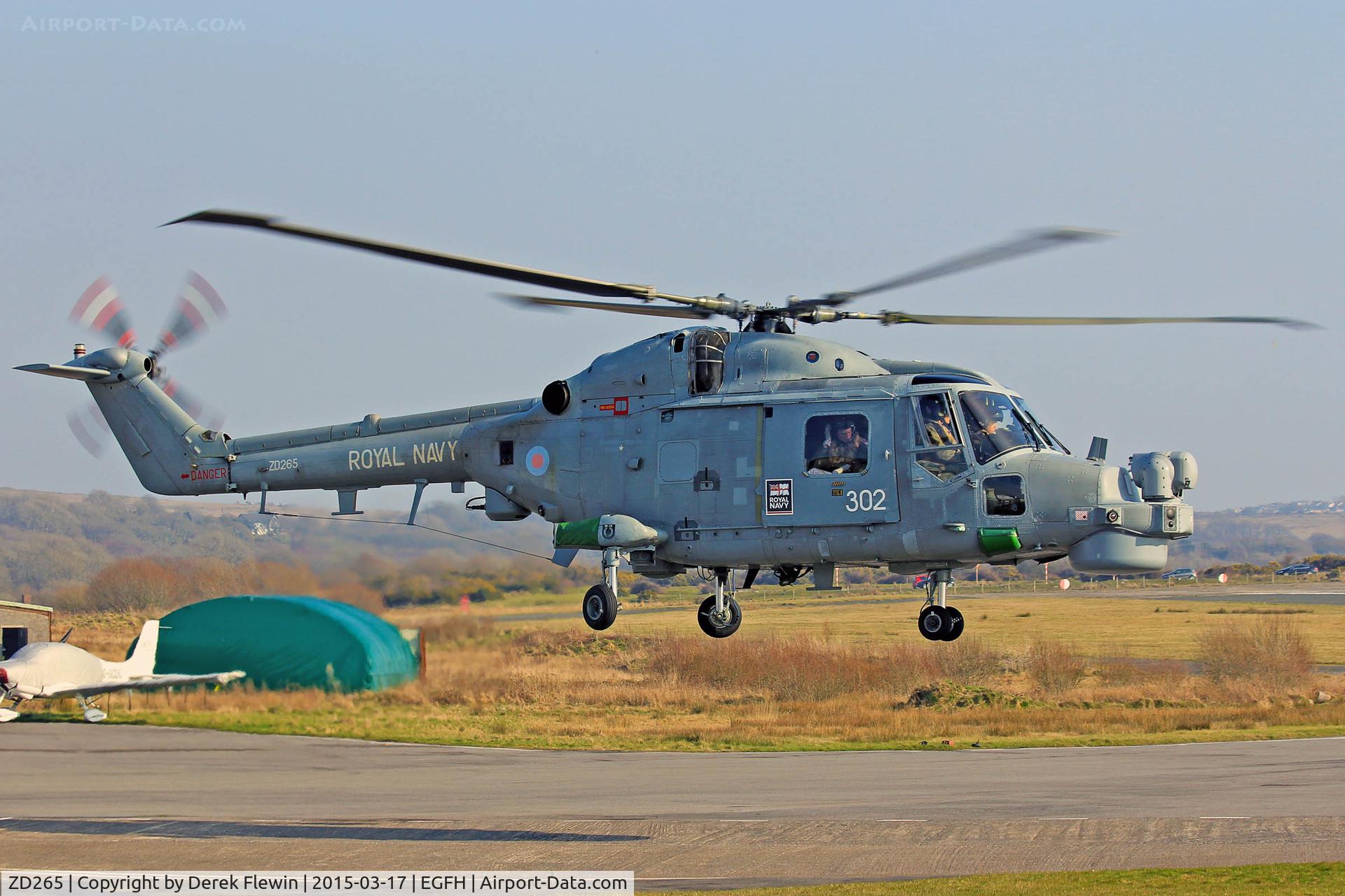 ZD265, 1983 Westland Lynx HMA.8SRU C/N 303, Visisting Lynx HMA.8SRU, Coded 302, HQ Flight, 815 NAS, RNAS Yeovilton based, seen lifting at EGFH after taking on fuel.