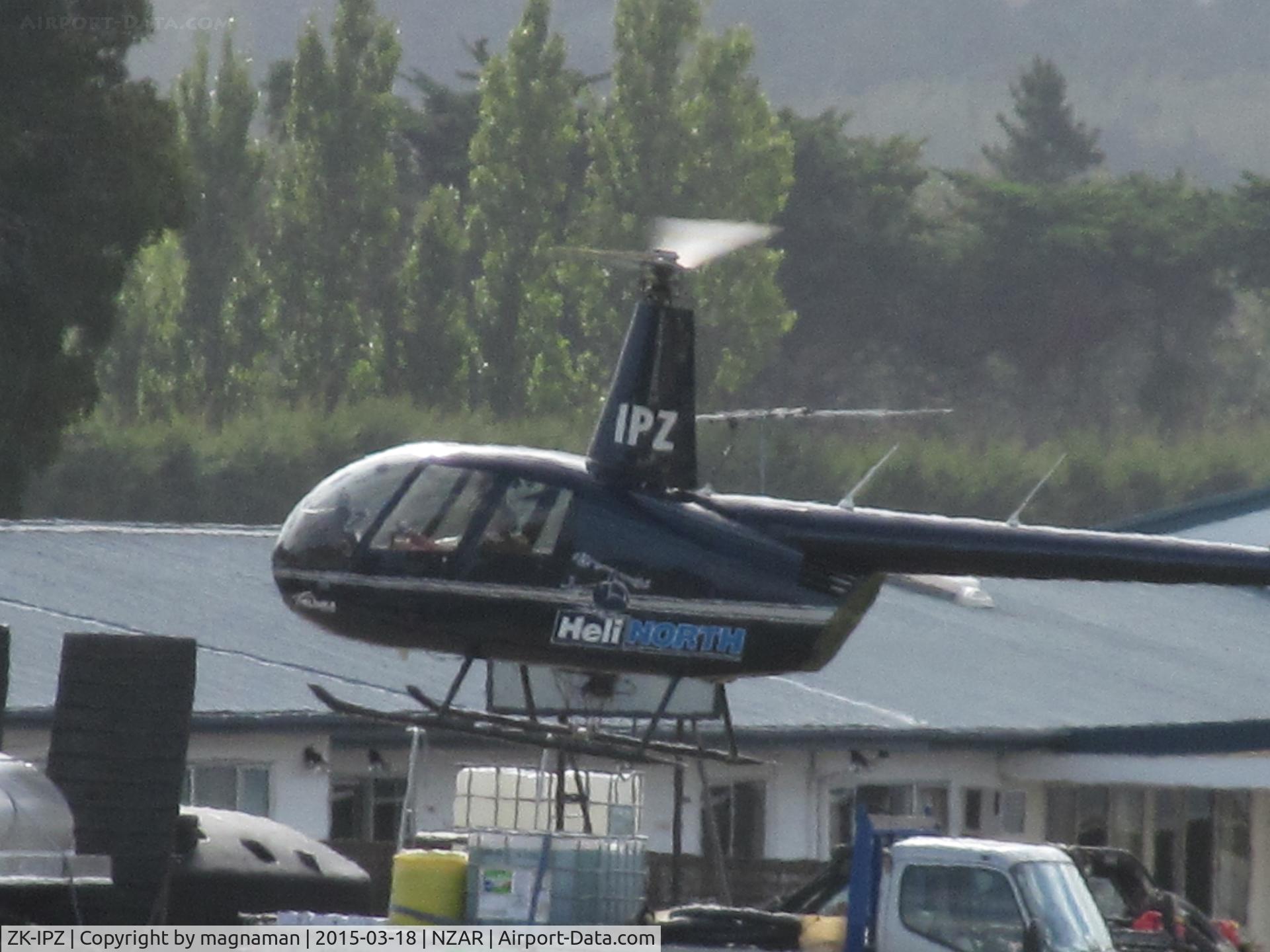 ZK-IPZ, 2007 Robinson R44 II C/N 11803, about to land on other side of runway