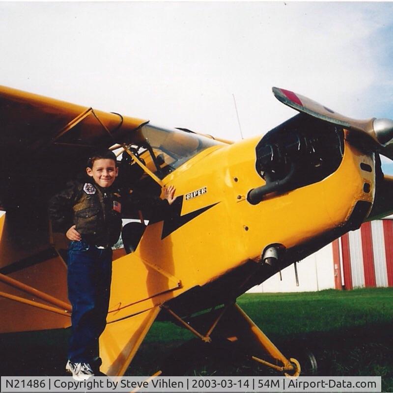 N21486, 1938 Piper J3F-60 C/N 2342, A young aviator. At Wolf River Airport, TN