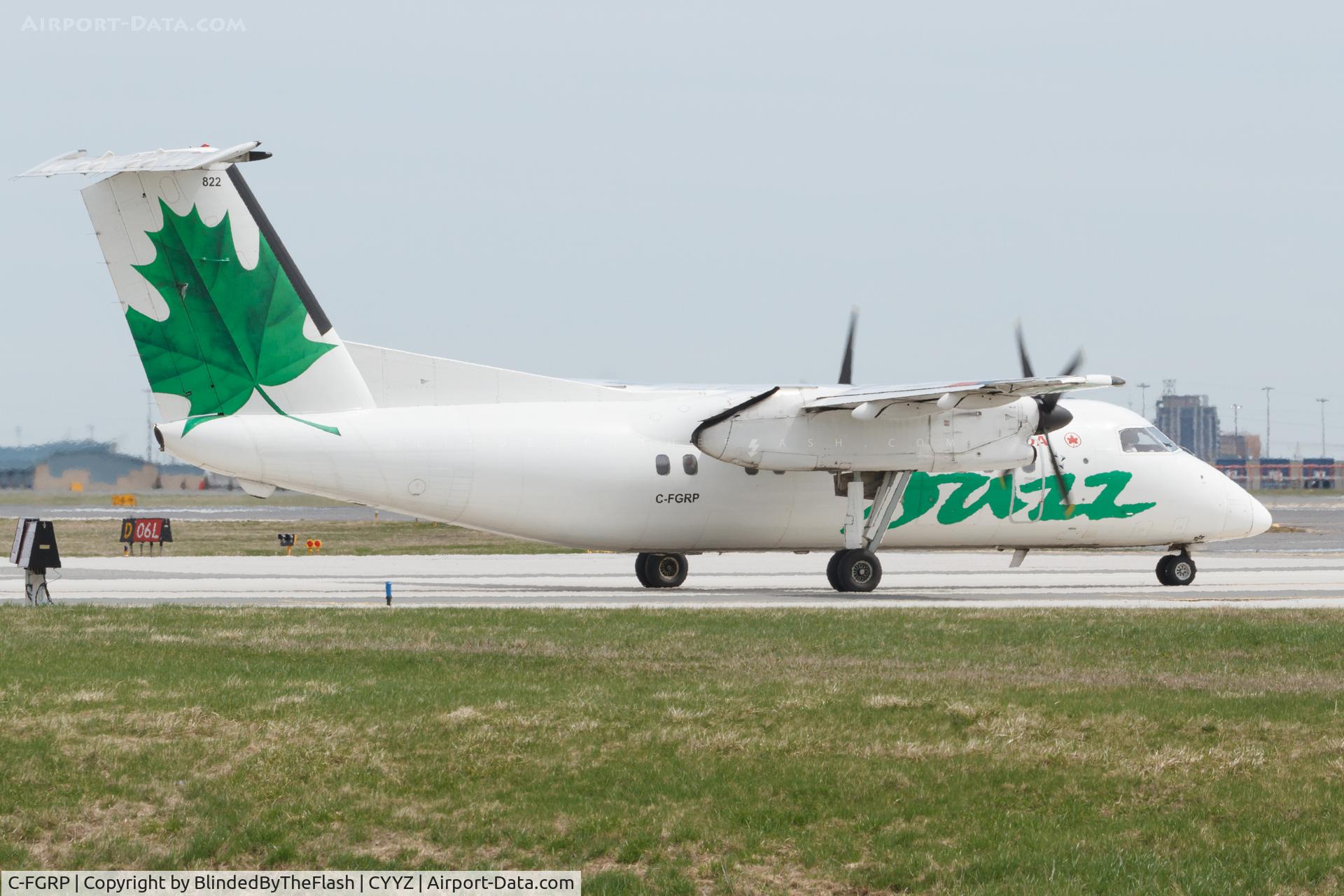 C-FGRP, 1990 De Havilland Canada DHC-8-102 Dash 8 C/N 207, Holding short of 06L at Toronto Pearson