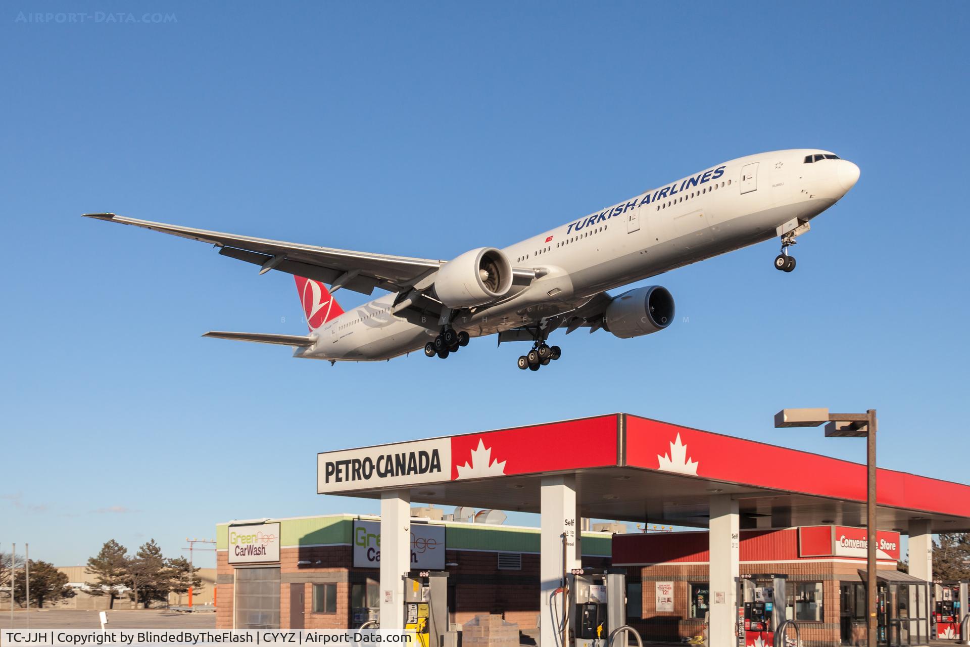 TC-JJH, 2010 Boeing 777-3F2/ER C/N 40792, Short final for runway 23 at Toronto Pearson, over the iconic Petro Canada gas station on Airport Rd.