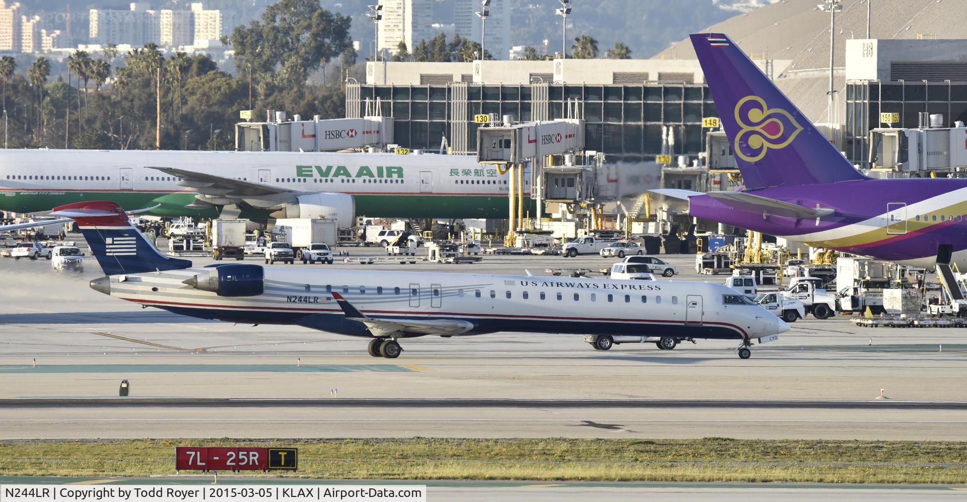 N244LR, 2009 Bombardier CRJ-900LR (CL-600-2D24) C/N 15233, Taxiing to gate at LAX