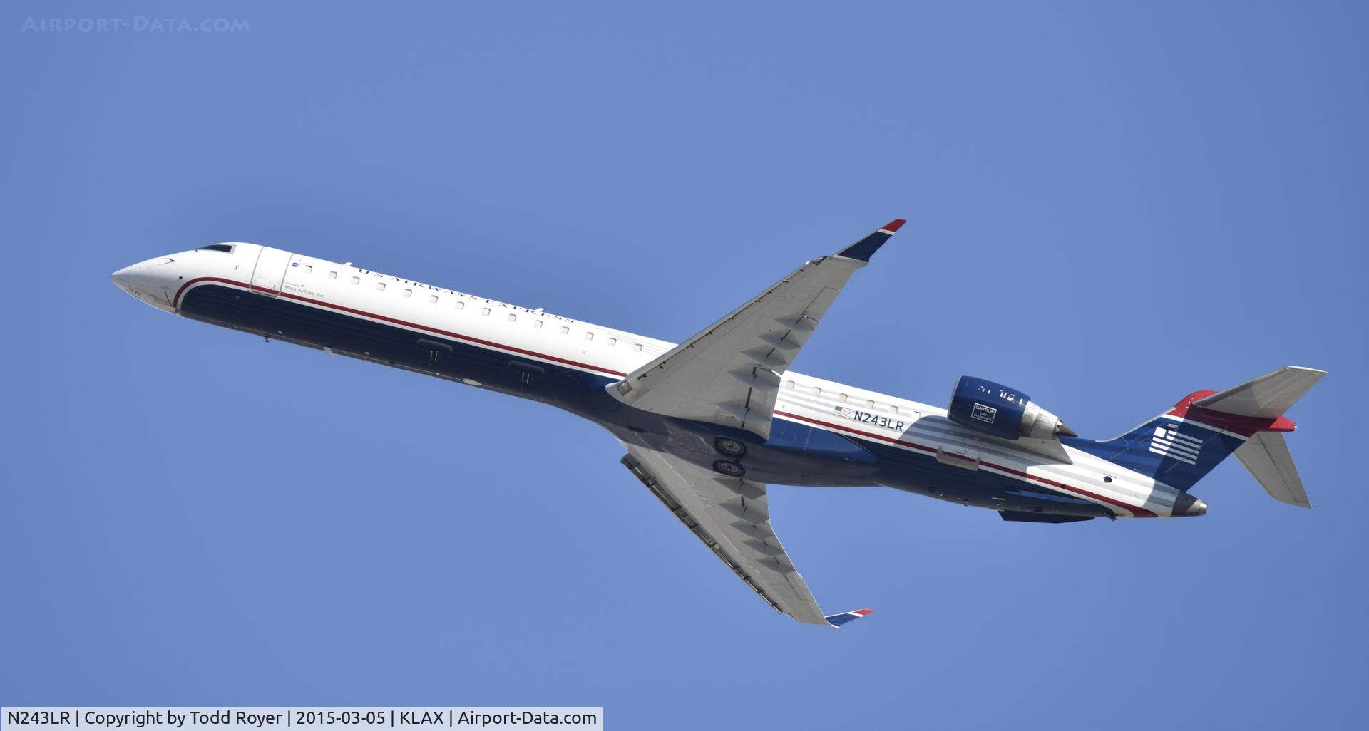 N243LR, 2006 Bombardier CRJ-900ER (CL-600-2D24) C/N 15064, Departing LAX on 25R