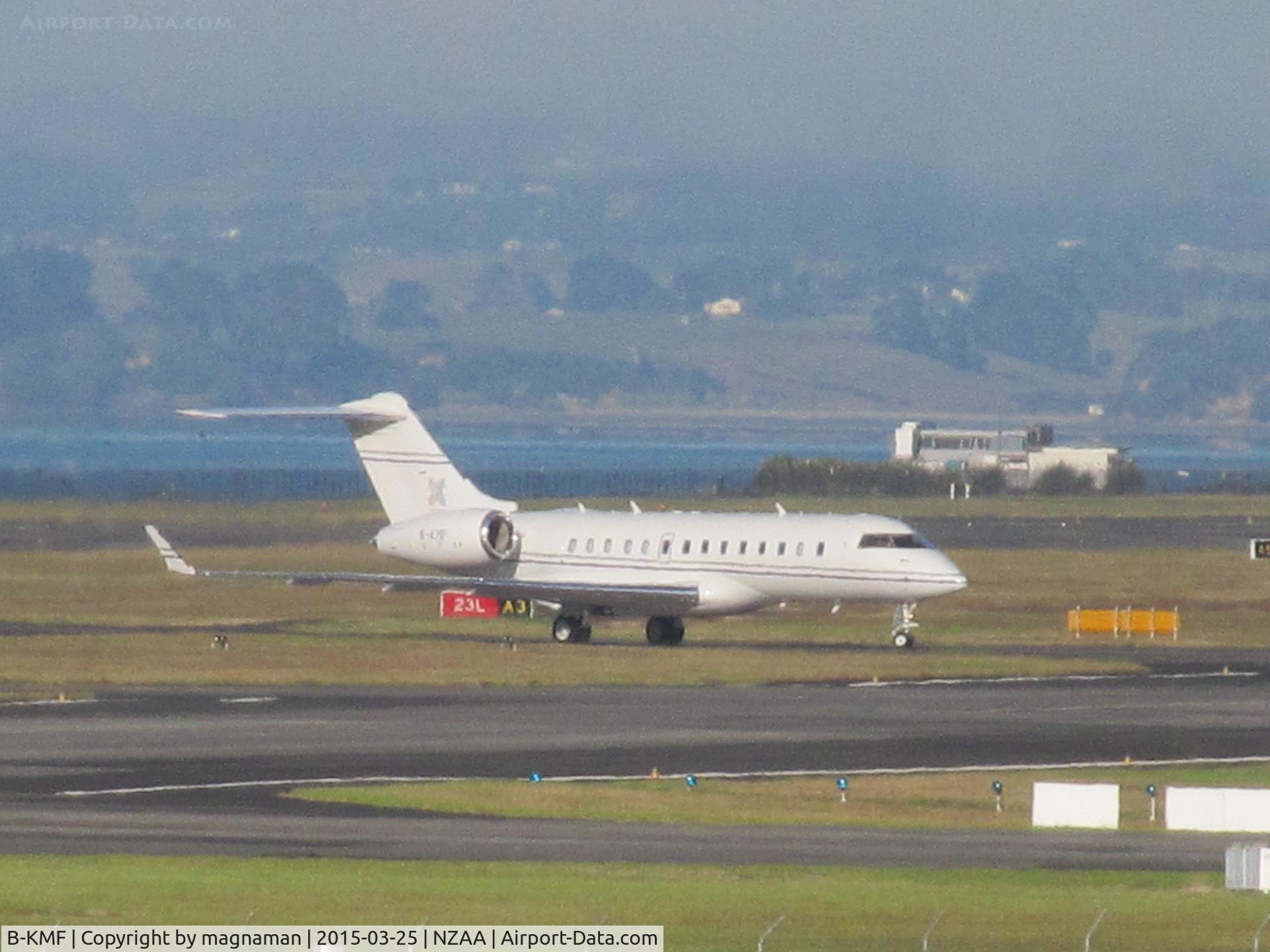 B-KMF, 2010 Bombardier BD-700-1A11 Global 5000 C/N 9998, long shot on landing with Manukau Habour in background