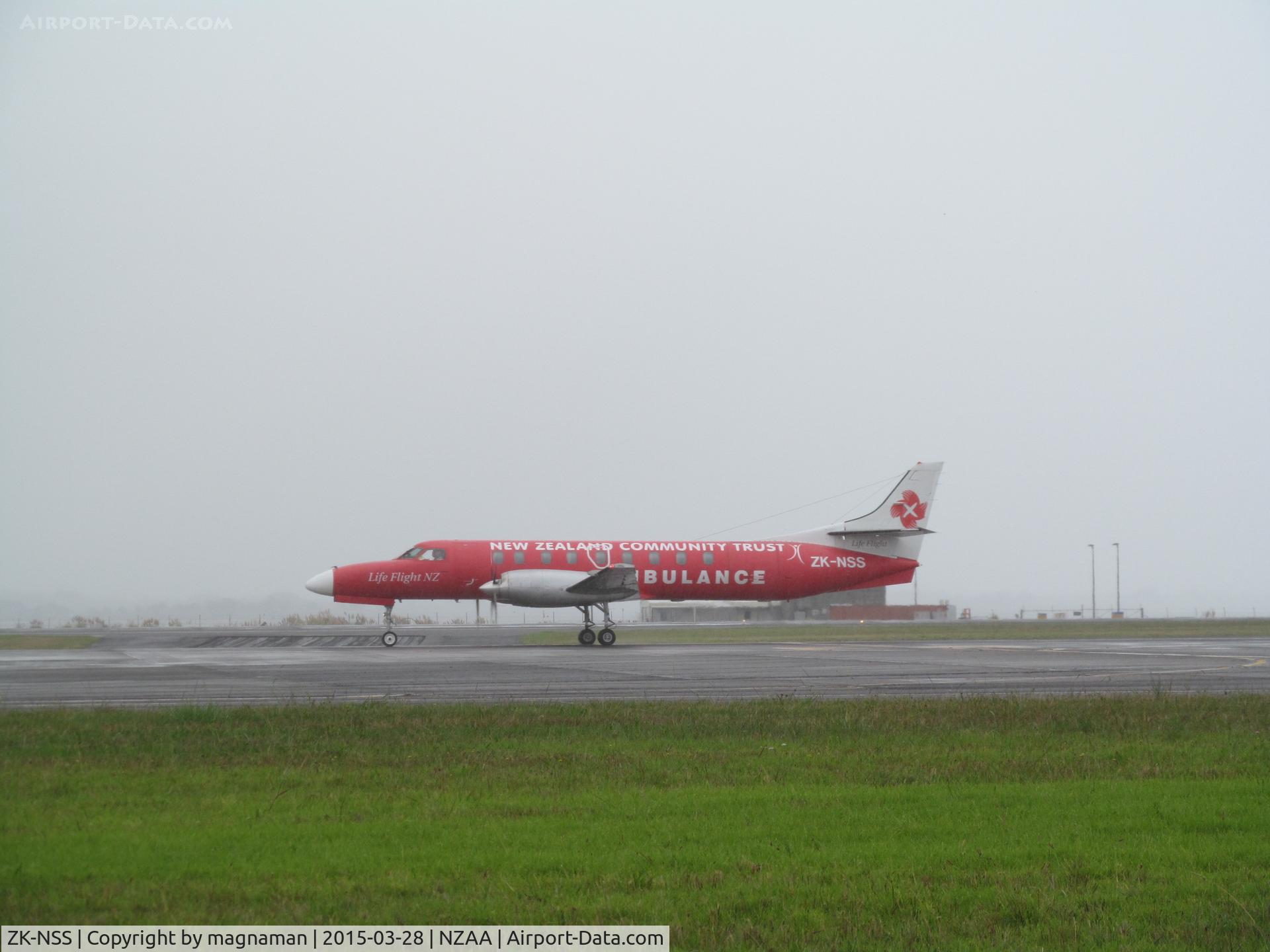 ZK-NSS, Fairchild SA-227AC Metro III C/N AC692, just landed and taxying past in very wet conditions