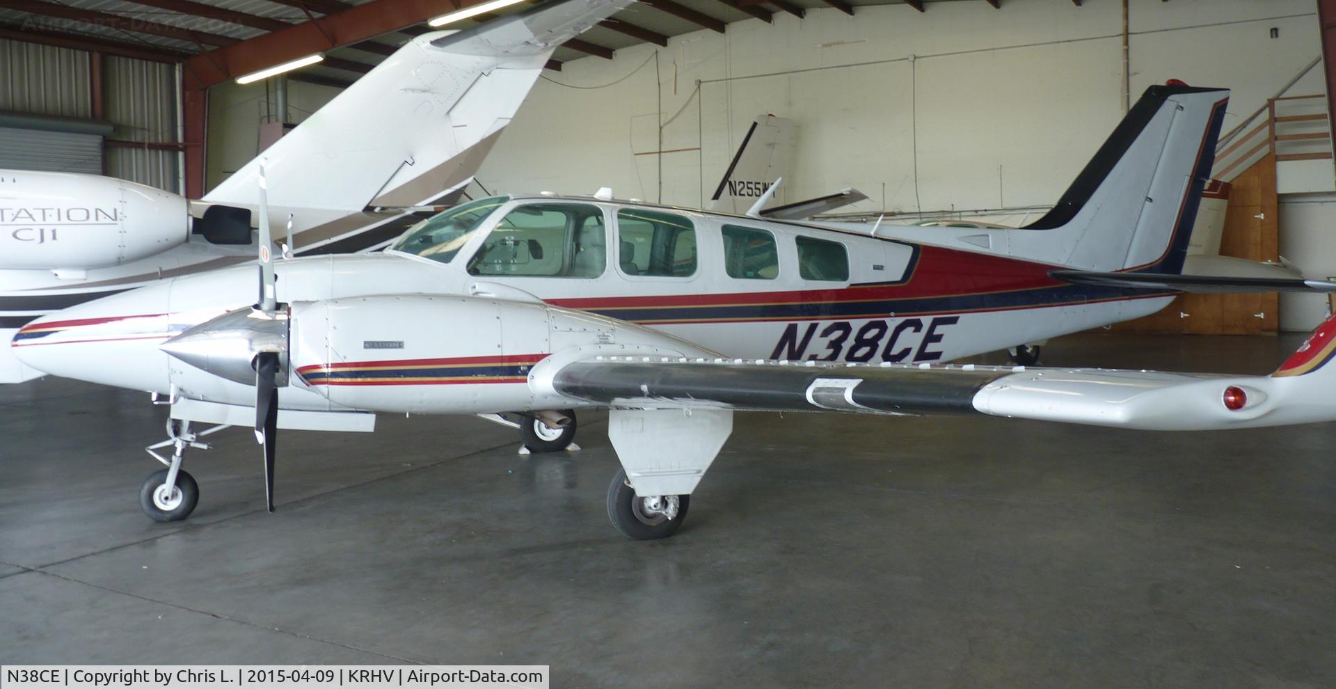 N38CE, 1971 Beech 58 Baron C/N TH-116, A local 1971 Beechcraft Baron 58 with a 4 bladed prop and winglets sitting inside the Lafferty Aircraft Sales hangar waiting to be sold.