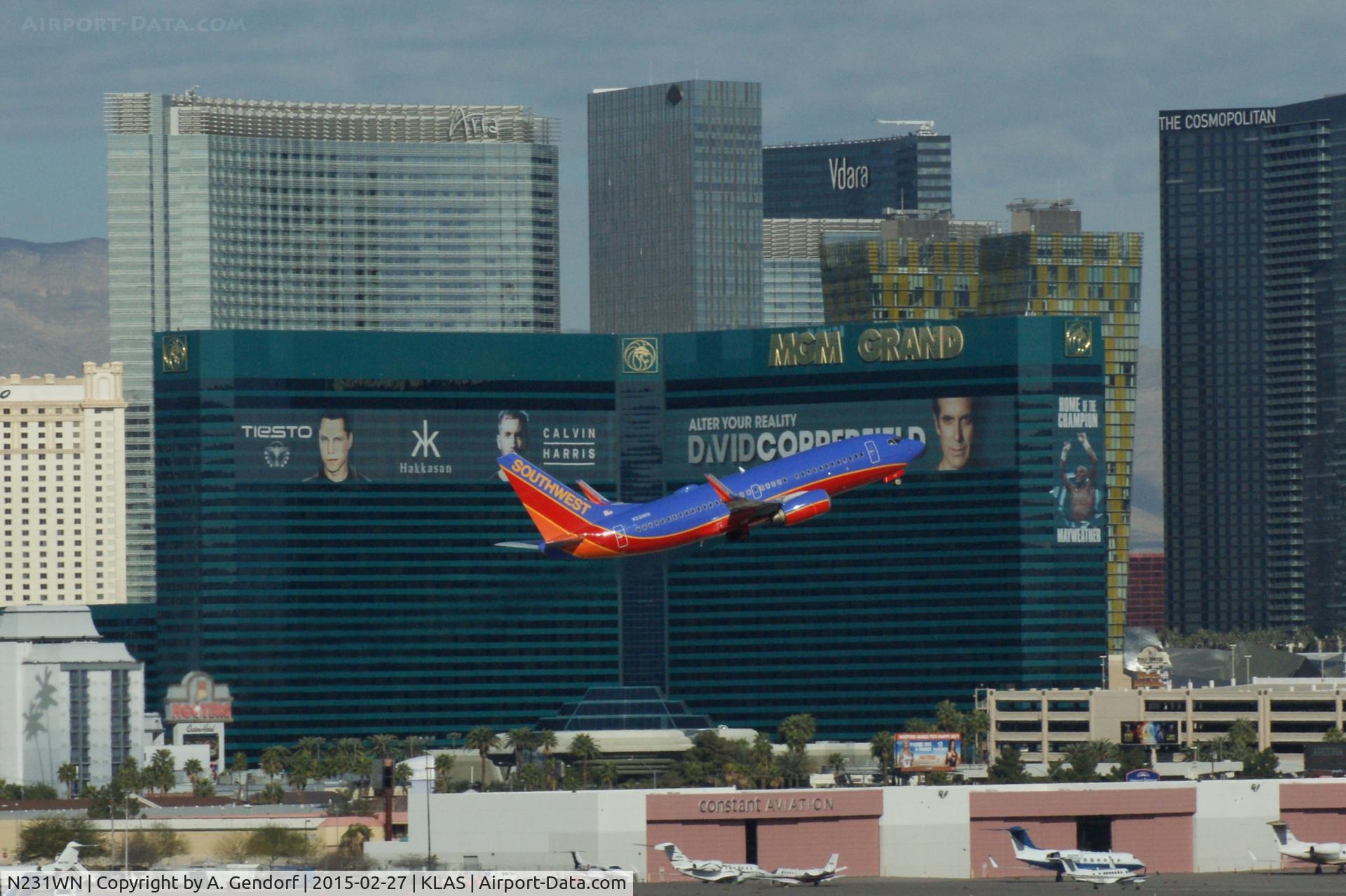 N231WN, 2006 Boeing 737-7H4 C/N 32499, Southwest Airlines, is here climbing out at Las Vegas Int'l(KLAS) in front of the famous MGM Grand Hotel