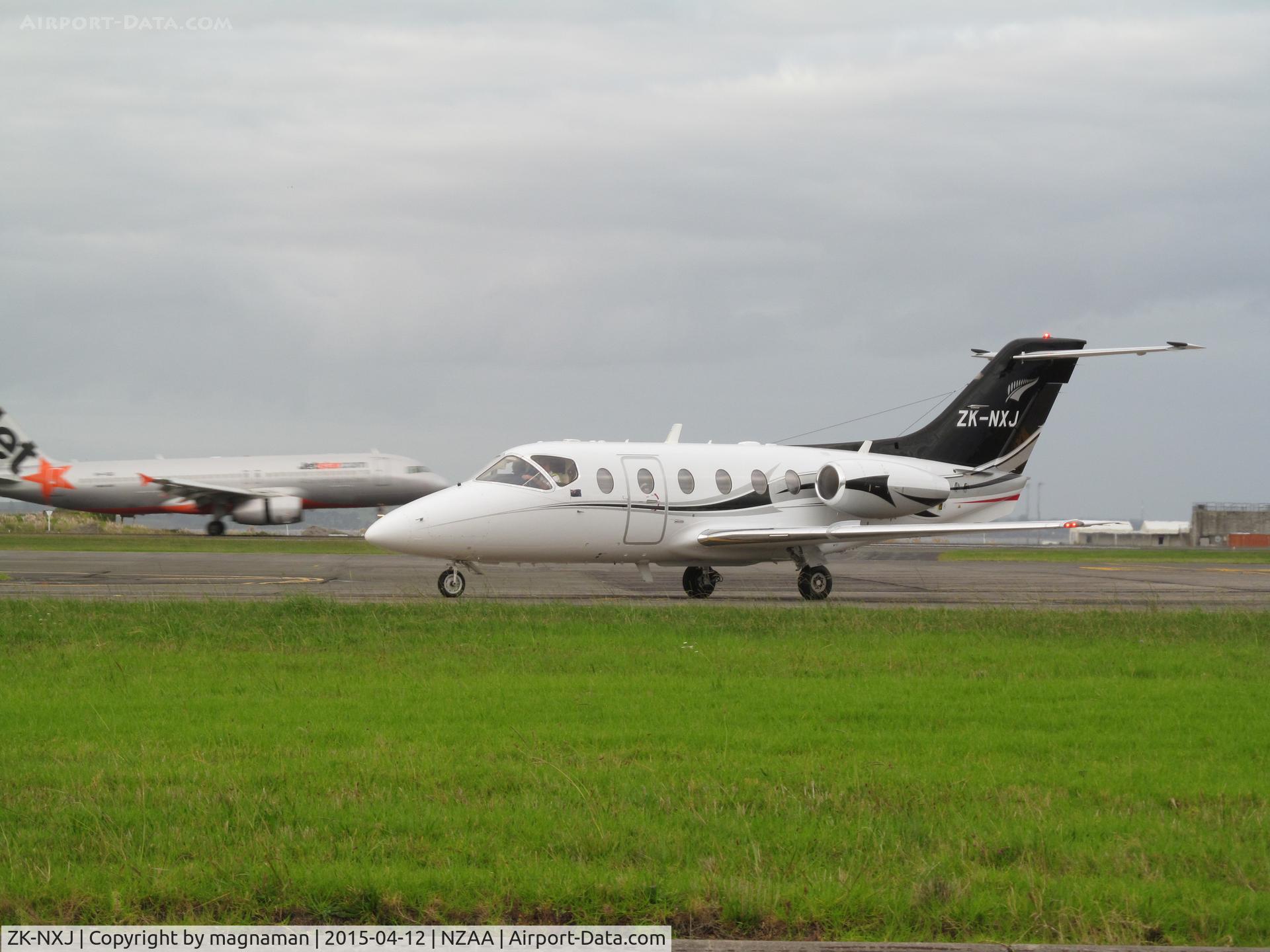 ZK-NXJ, 1998 Raytheon Beechjet 400A C/N RK-210, turning onto near taxyway