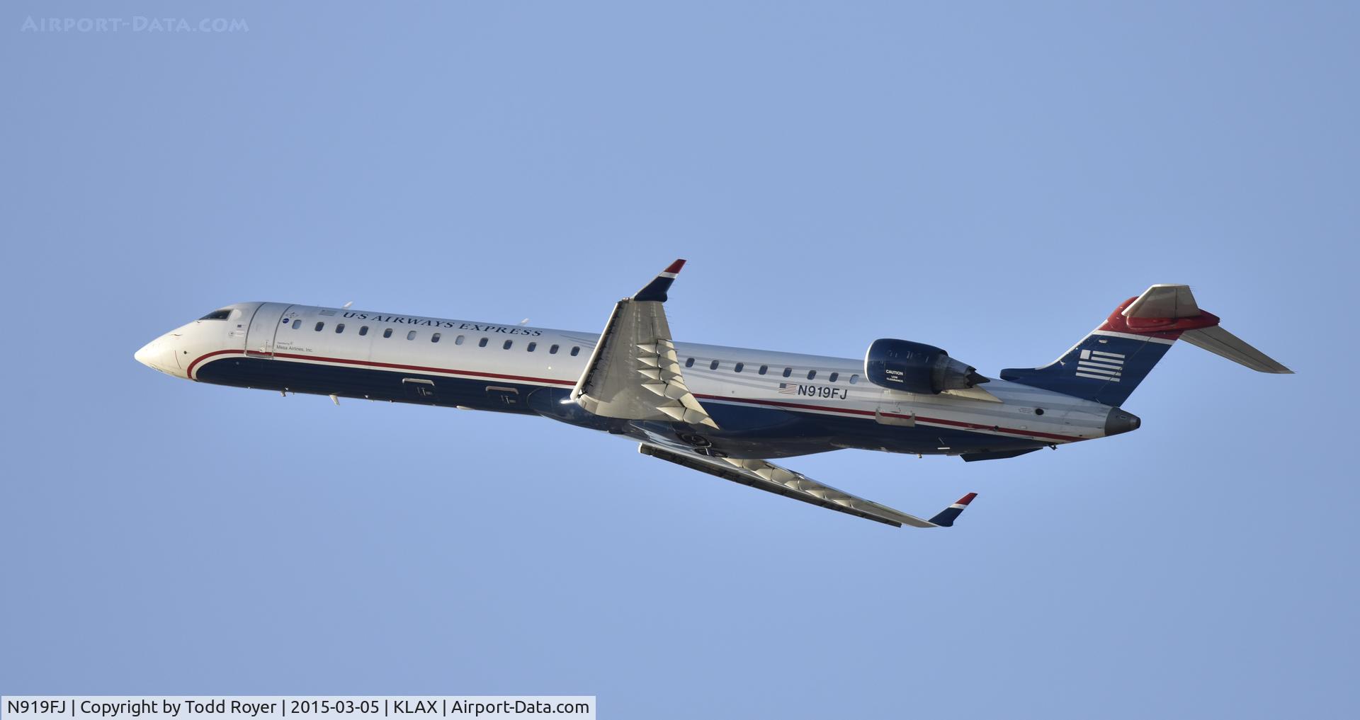 N919FJ, 2004 Bombardier CRJ-900ER (CL-600-2D24) C/N 15019, Departing LAX on 25R