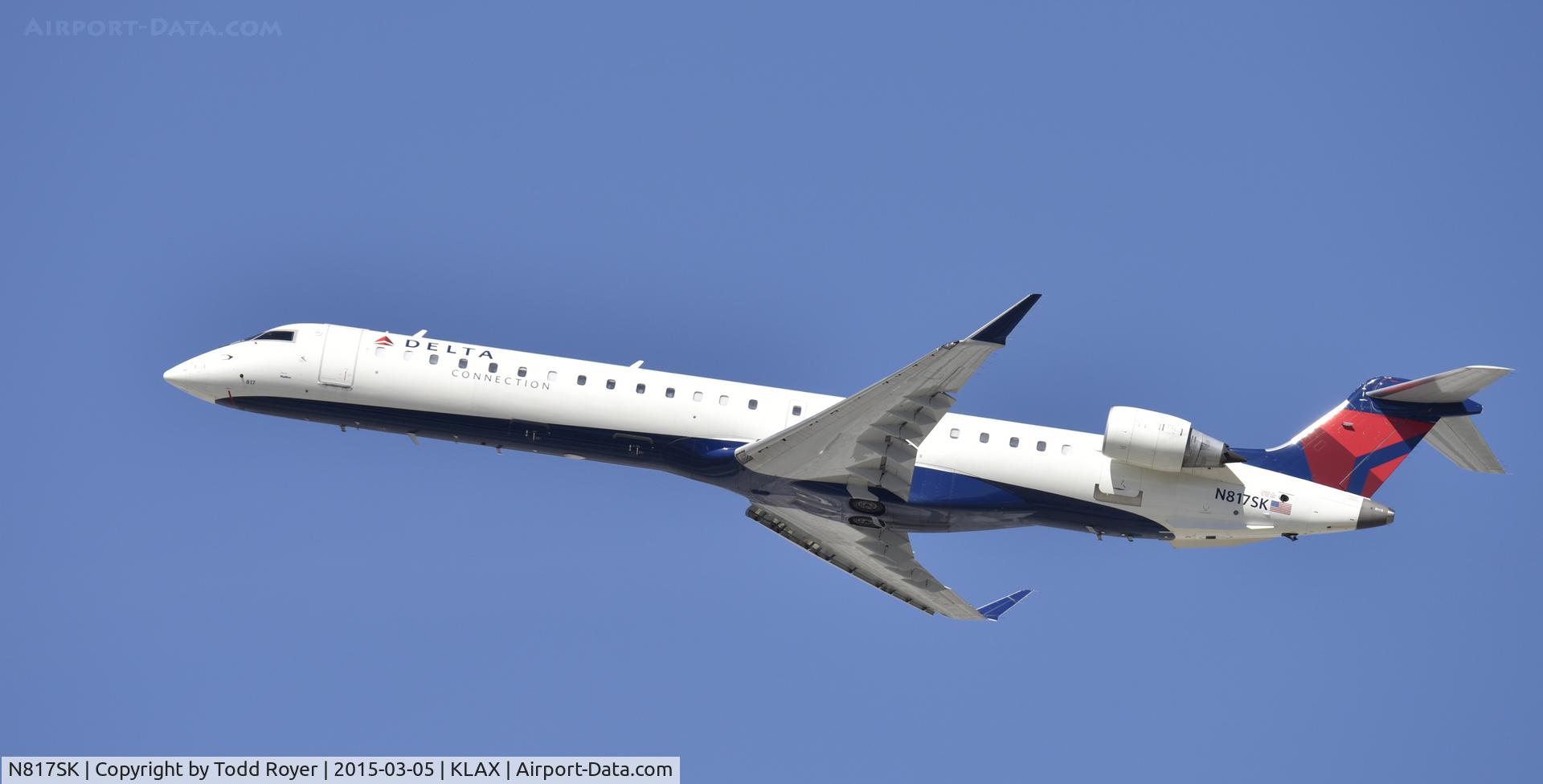 N817SK, 2006 Bombardier CRJ-900ER (CL-600-2D24) C/N 15107, Departing LAX on 25R