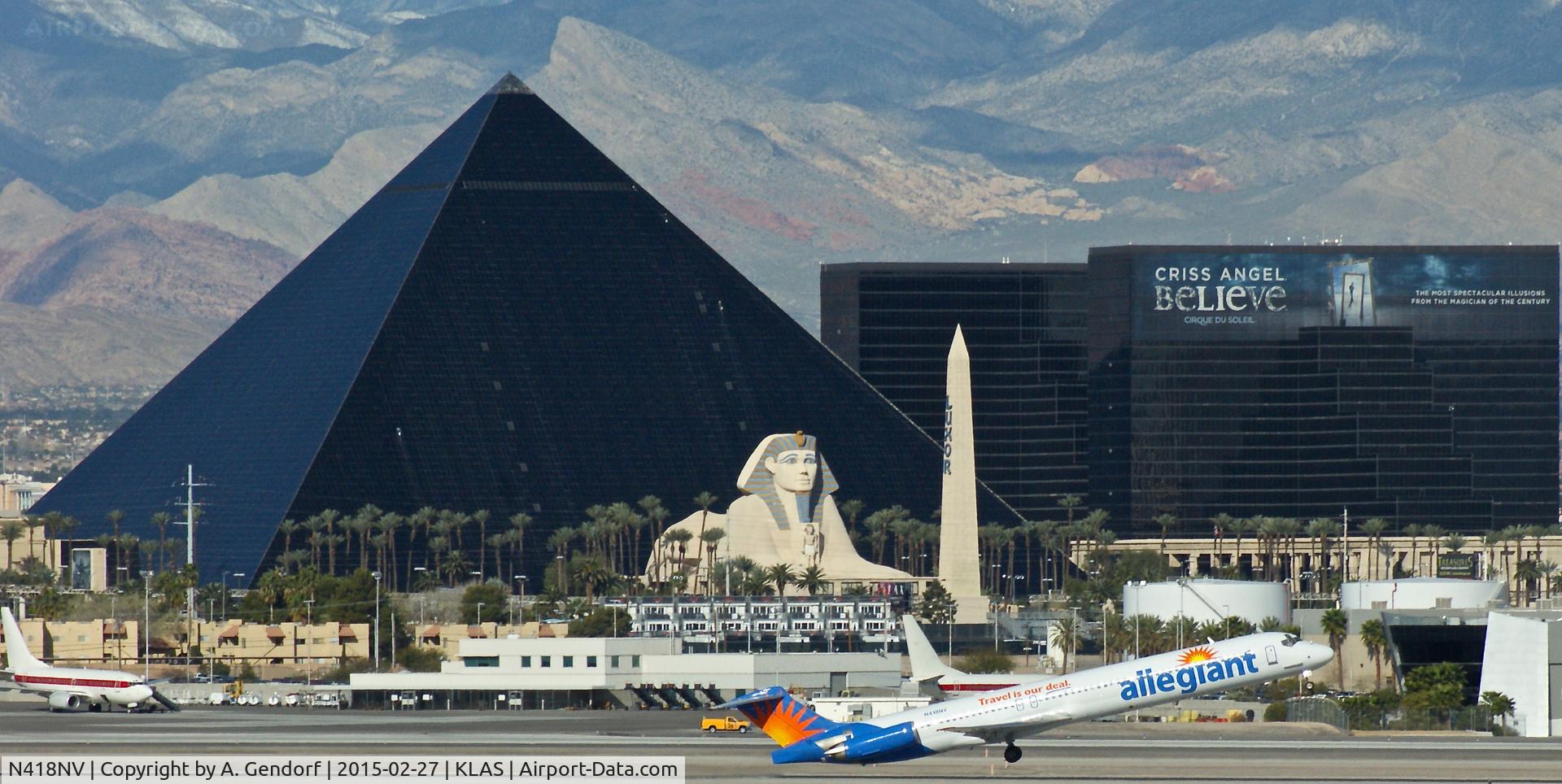 N418NV, 1988 McDonnell Douglas MD-82 (DC-9-82) C/N 49615, Allegiant Air, seen here taking off in front of the famous Luxor Hotel at Las Vegas Int'l(KLAS)