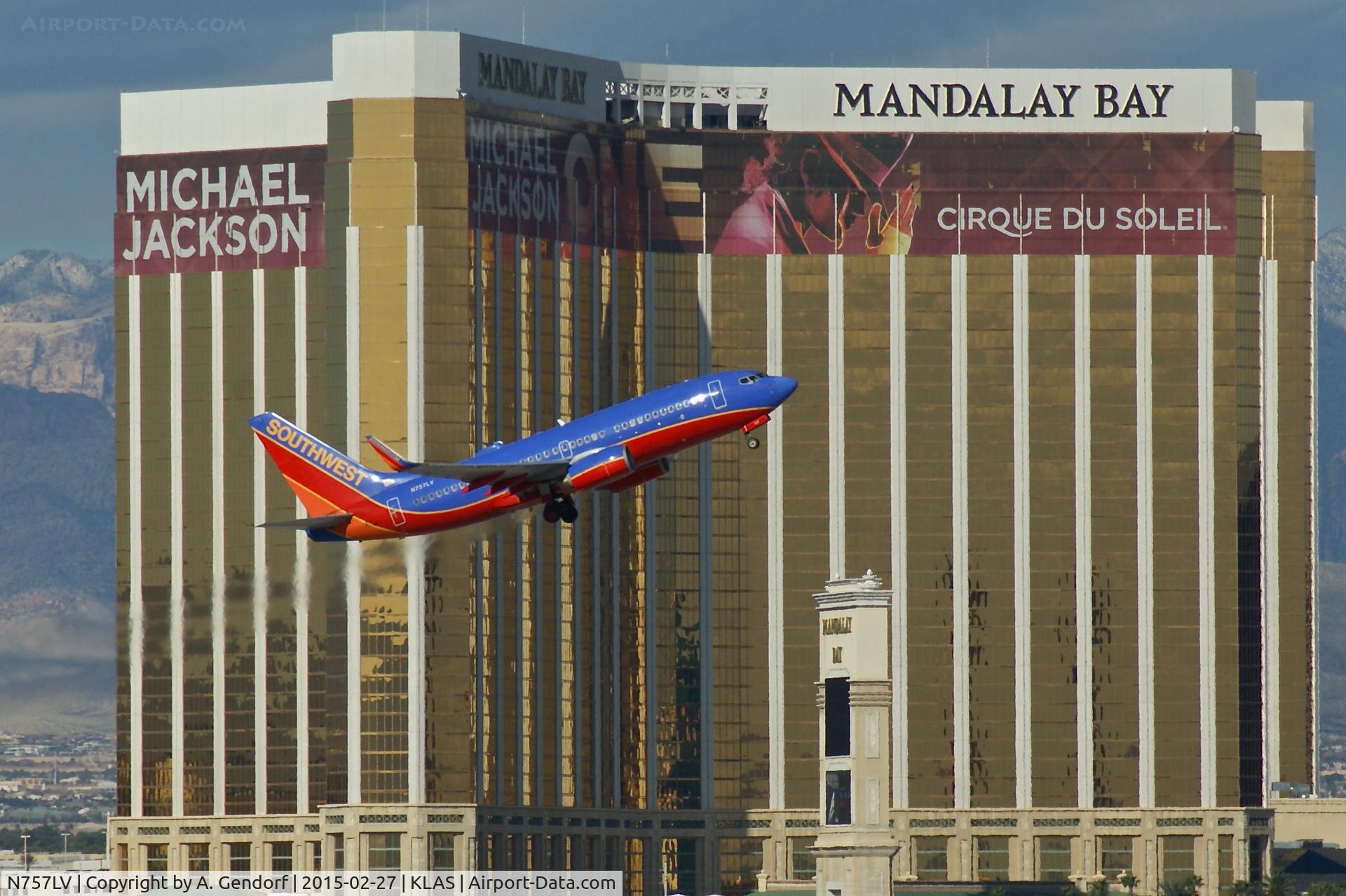 N757LV, 1999 Boeing 737-7H4 C/N 29850, Southwest Airlines, is here climbing out Las Vegas(KLAS) in front of the Mandalay Bay Hotel