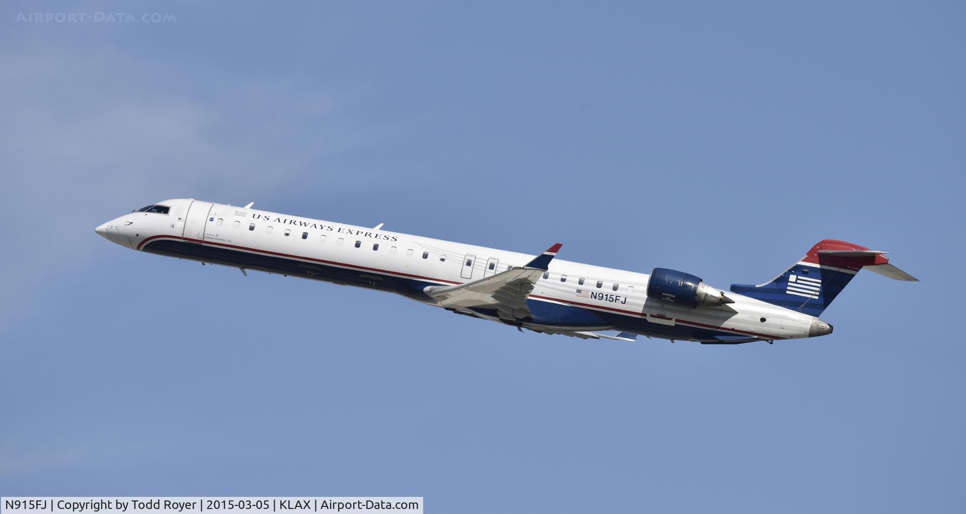 N915FJ, 2004 Bombardier CRJ900 (CL-600-2D24) C/N 15015, Departing LAX on 25R