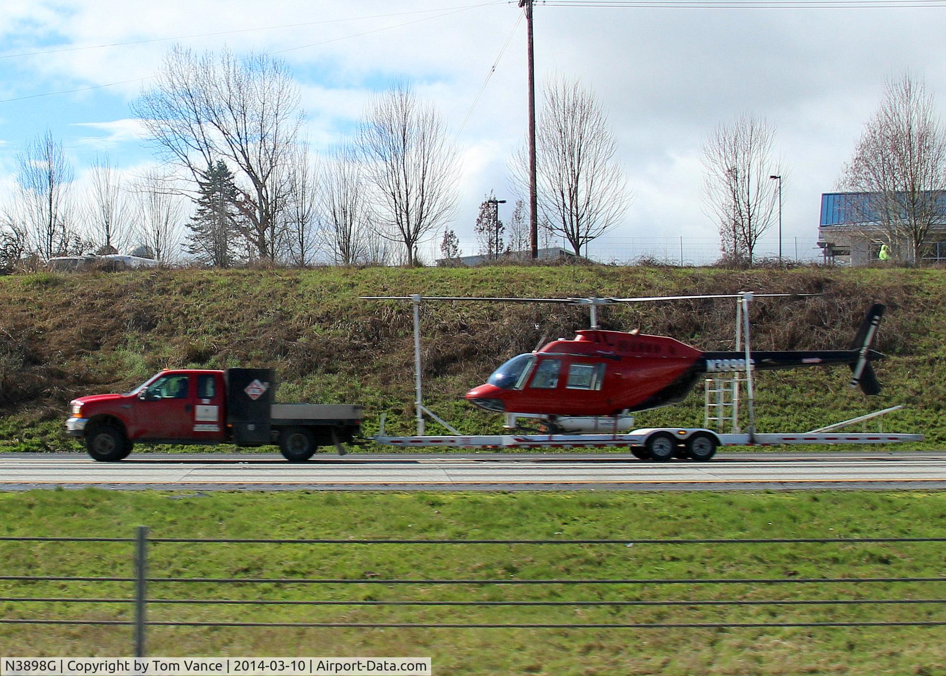 N3898G, Bell 206B C/N 3207, SB I-5 north of Vancouver,WA. Bell Chopper 206B being truck south...
