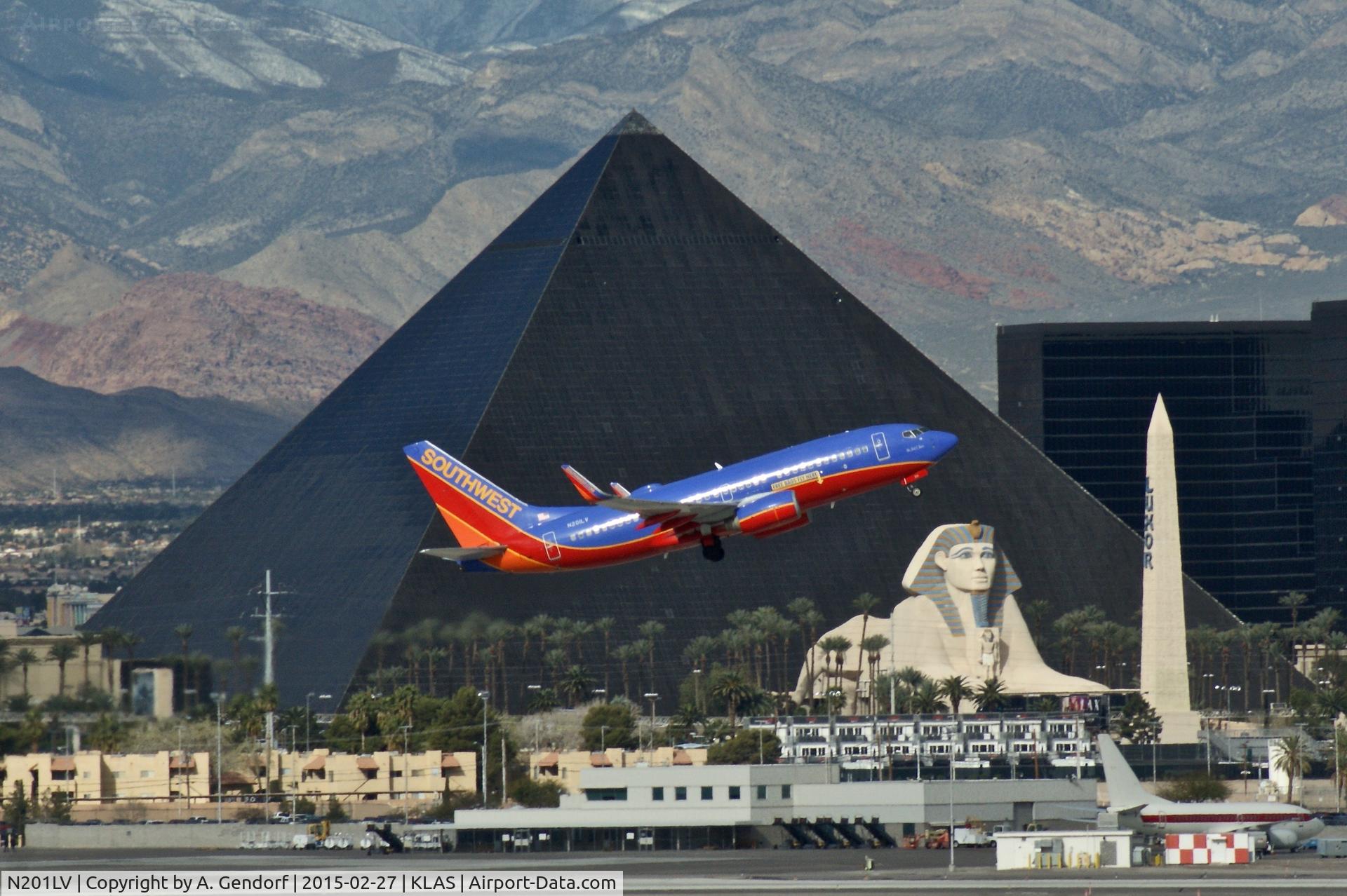 N201LV, 2005 Boeing 737-7H4 C/N 29854, Southwest Airlines, is here departing Las Vegas Int'l(KLAS), in front of the famous Luxor Hotel