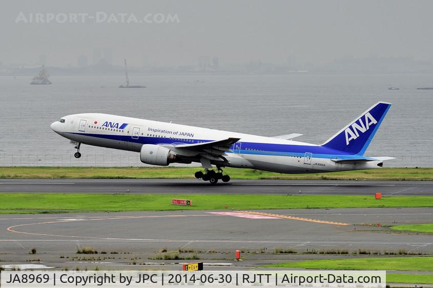 JA8969, 1996 Boeing 777-281 C/N 27032, Taking off in the rainy morning