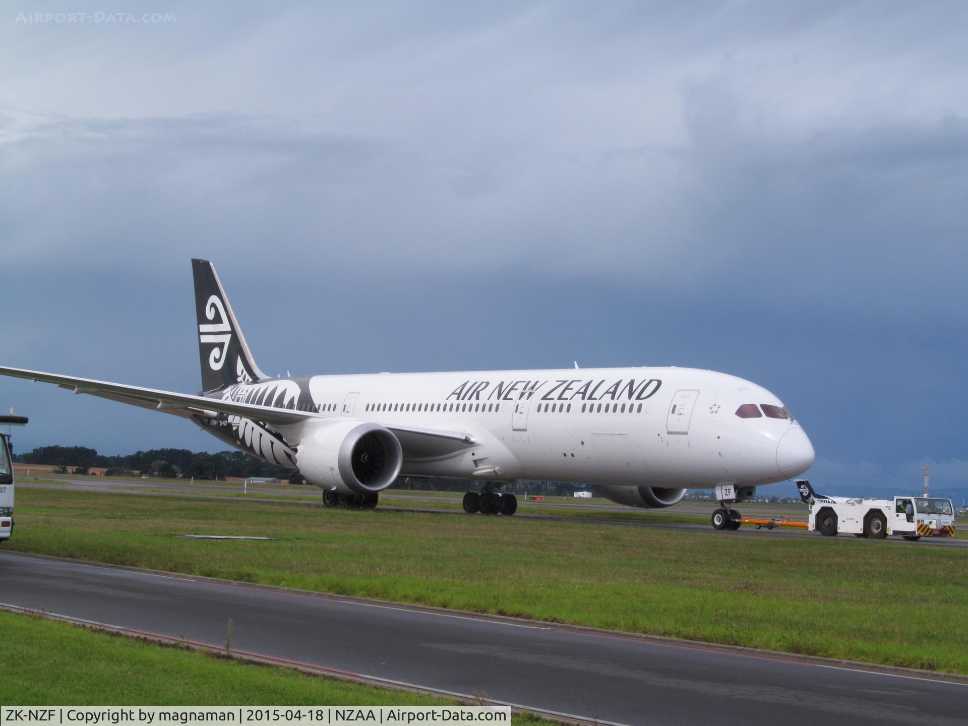 ZK-NZF, 2014 Boeing 787-9 Dreamliner C/N 34335, being towed back to stand following lightning strike check.