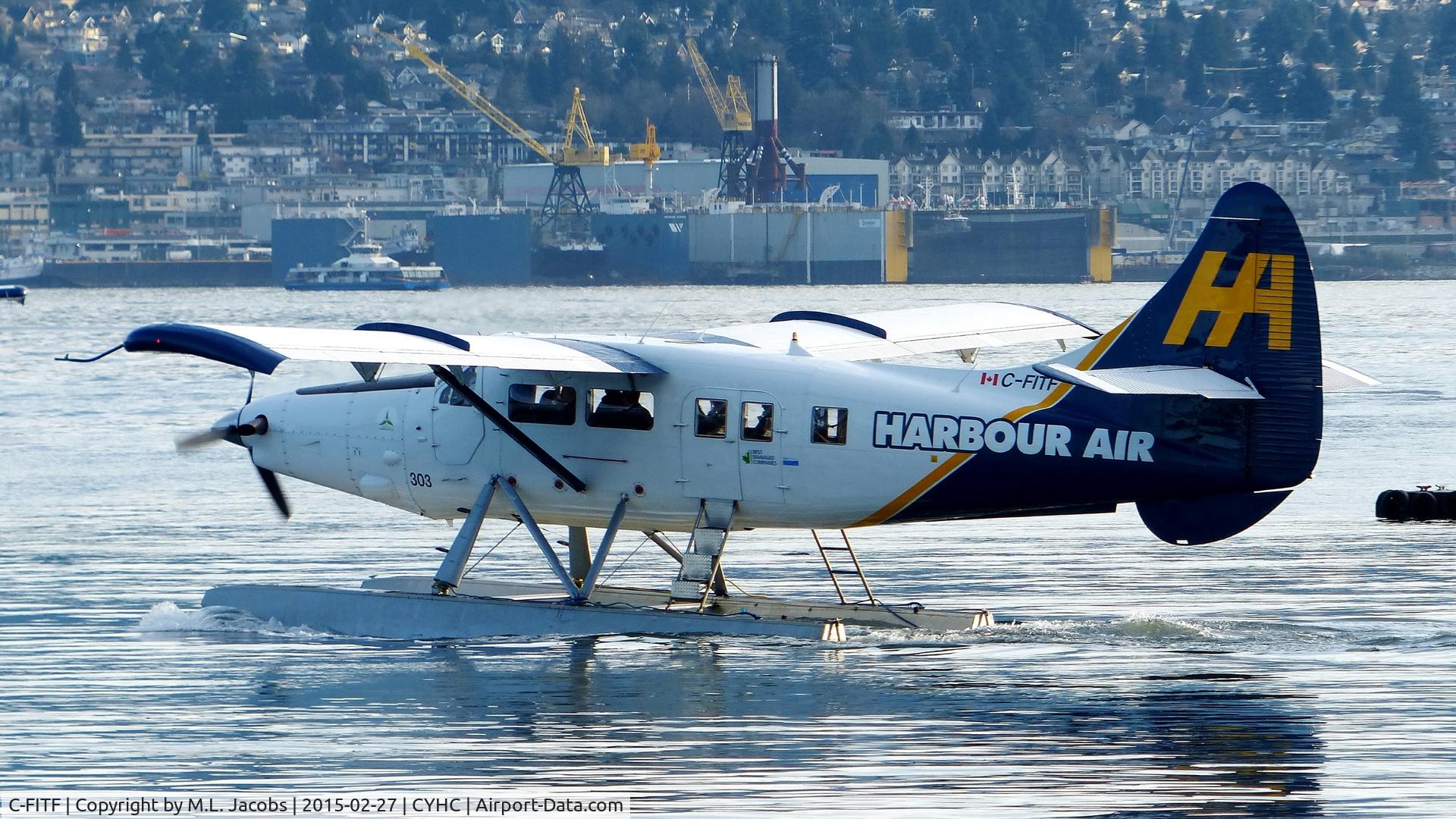C-FITF, 1955 De Havilland Canada DHC-3T Vazar Turbine Otter C/N 89, Harbour Air #303 taxiing for takeoff in Coal Harbour.