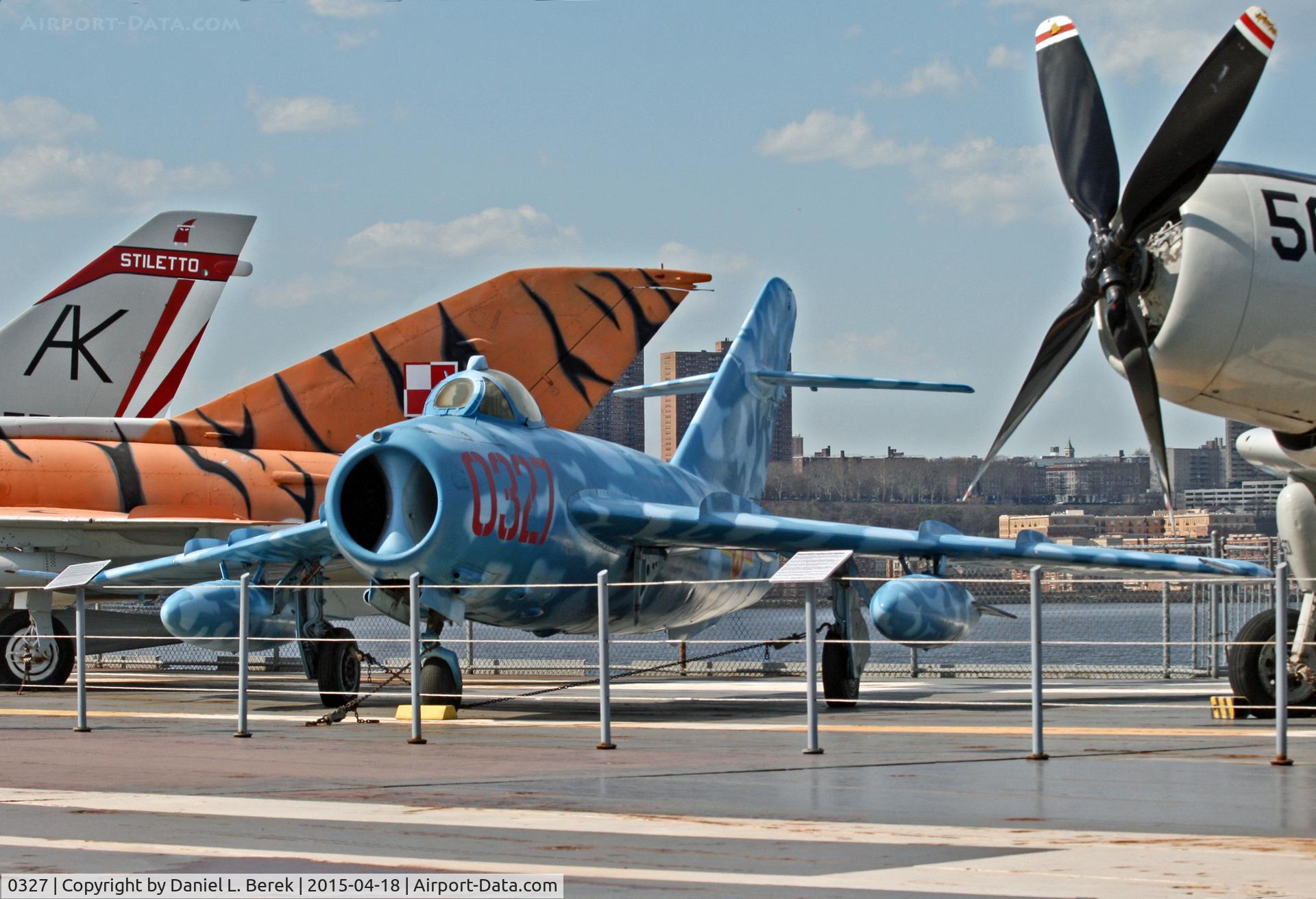 0327, PZL-Mielec Lim-5 (MiG-17F) C/N 1C0327, Nice to see this aircraft so beautifully repainted. It sits next to a former nemesis, the Douglas Skyraider.