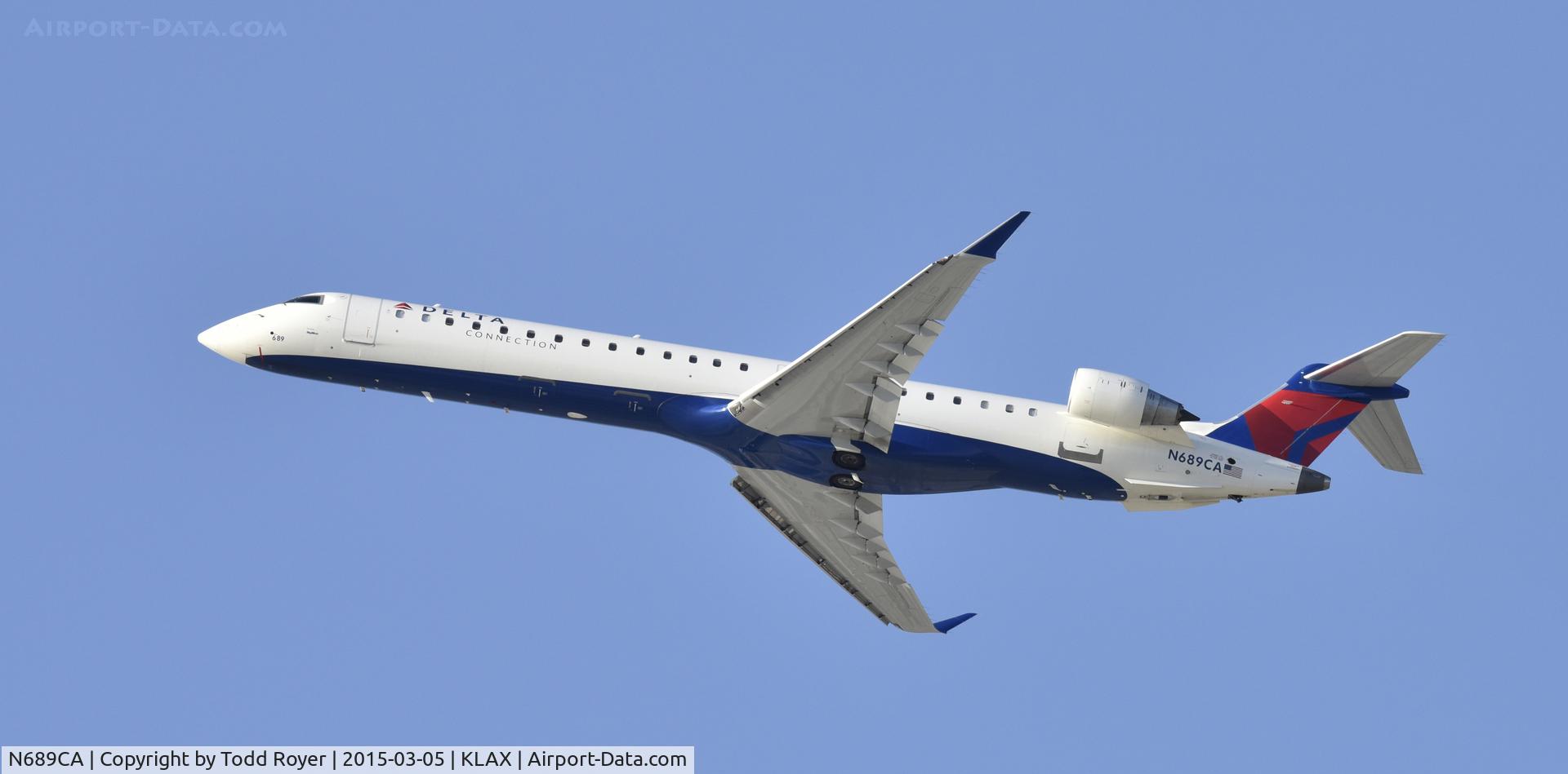 N689CA, 2007 Bombardier CRJ-900ER (CL-600-2D24) C/N 15133, Departing LAX on 25R