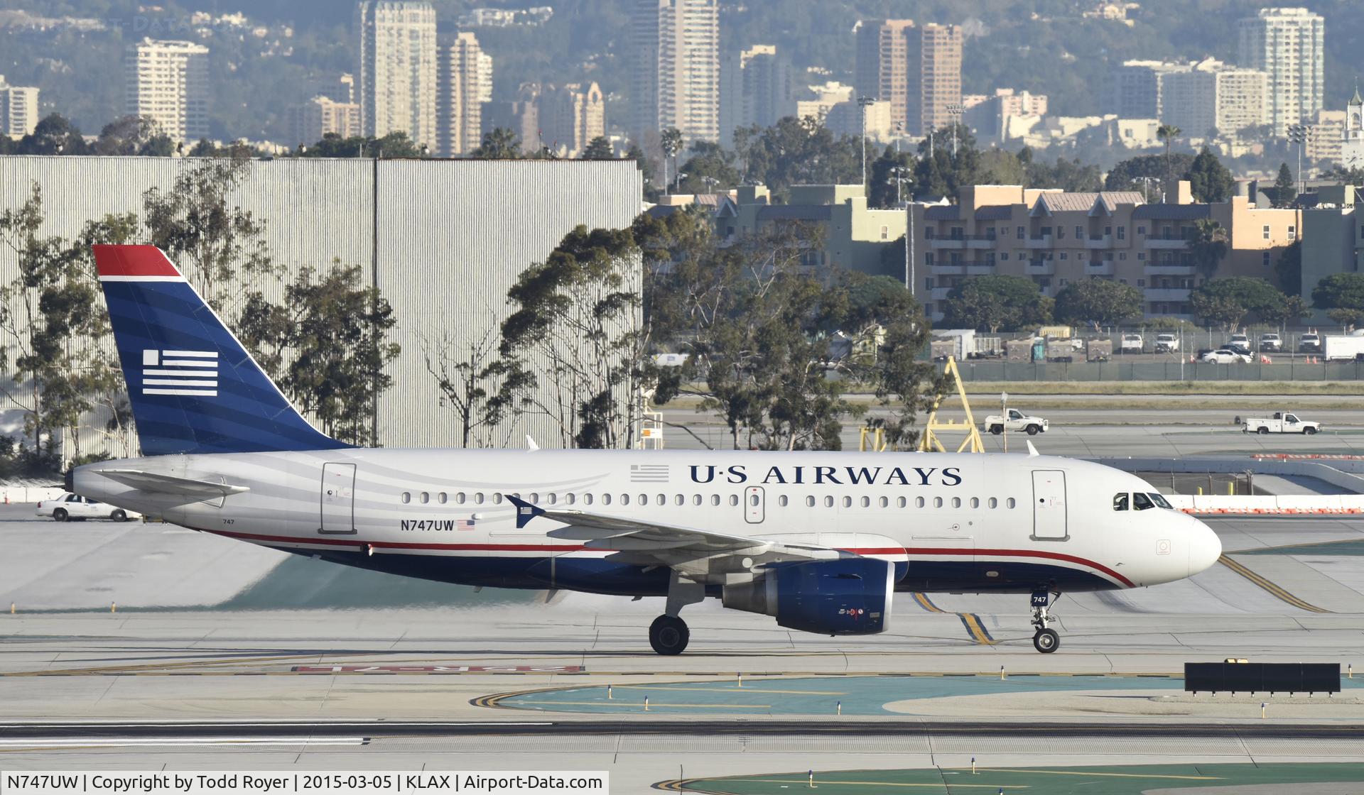 N747UW, 2000 Airbus A319-112 C/N 1301, Taxiing to gate at LAX
