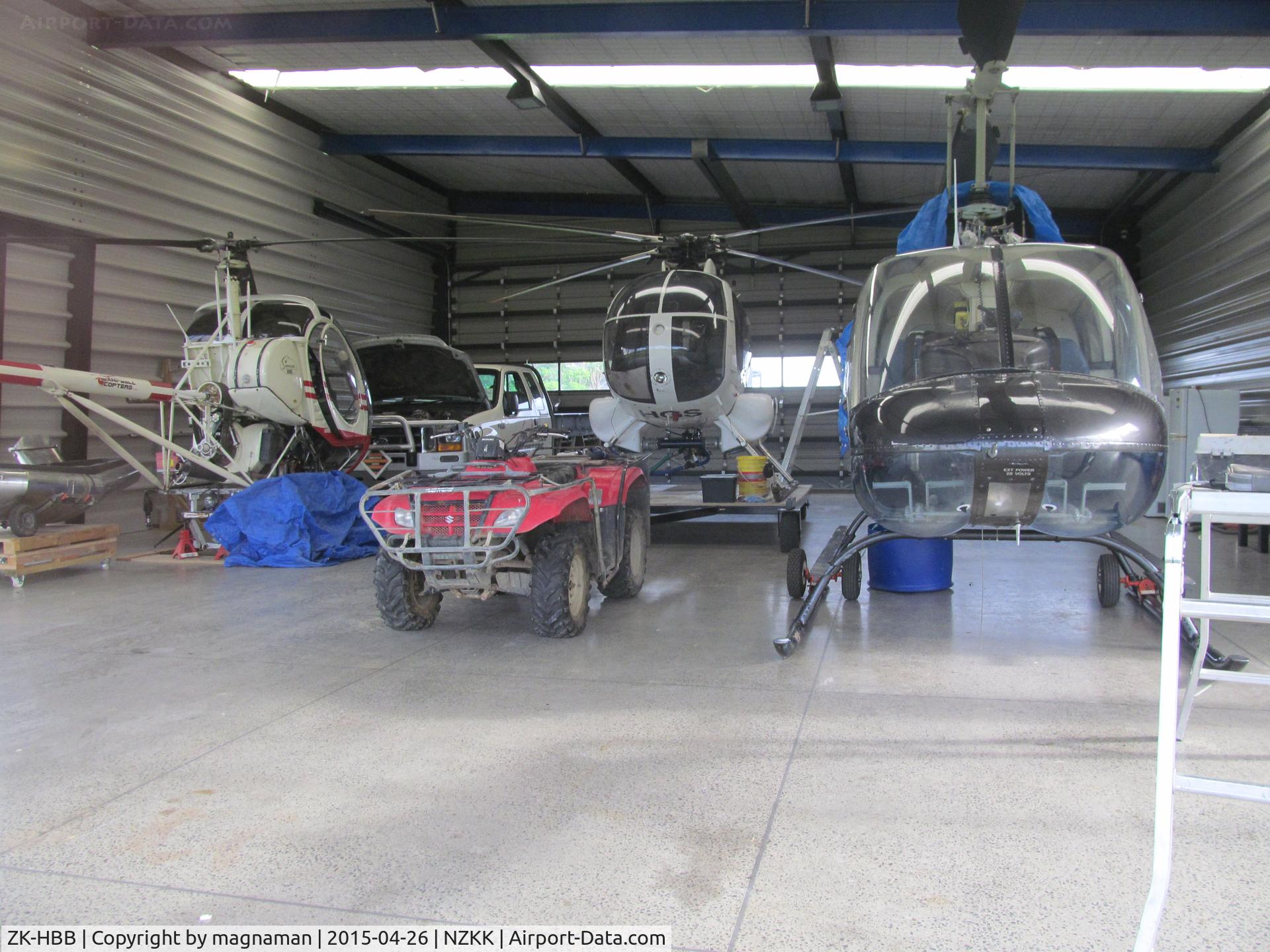ZK-HBB, Bell 206B JetRanger C/N 231, Closest to camera - plus HGS and HRL in roadside hangar on SH10 in KeriKeri