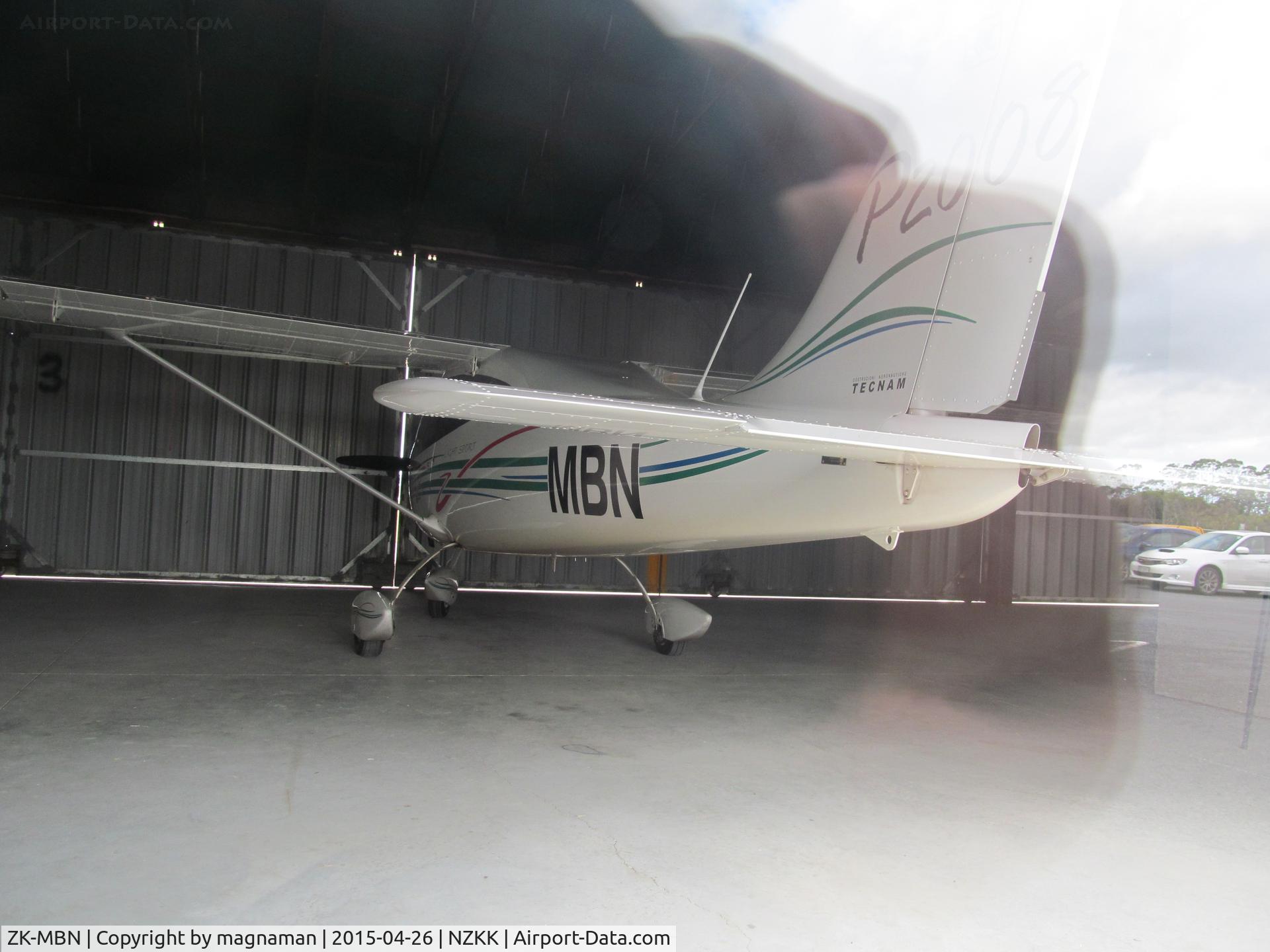 ZK-MBN, Tecnam P-2008 C/N 069, Not a PA44 but Tecnam P2008 c/n 069. In hangar at Keri Keri but with rear window for viewing. Photo quality not great due to reflections.