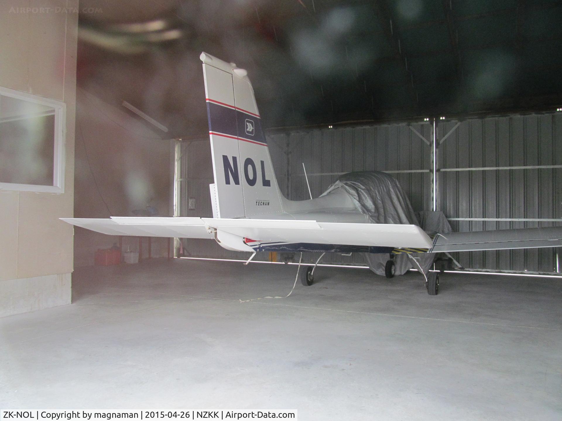 ZK-NOL, Tecnam P-96 Golf C/N 136, In hangar at Keri Keri - viewed from car park through rear window.
