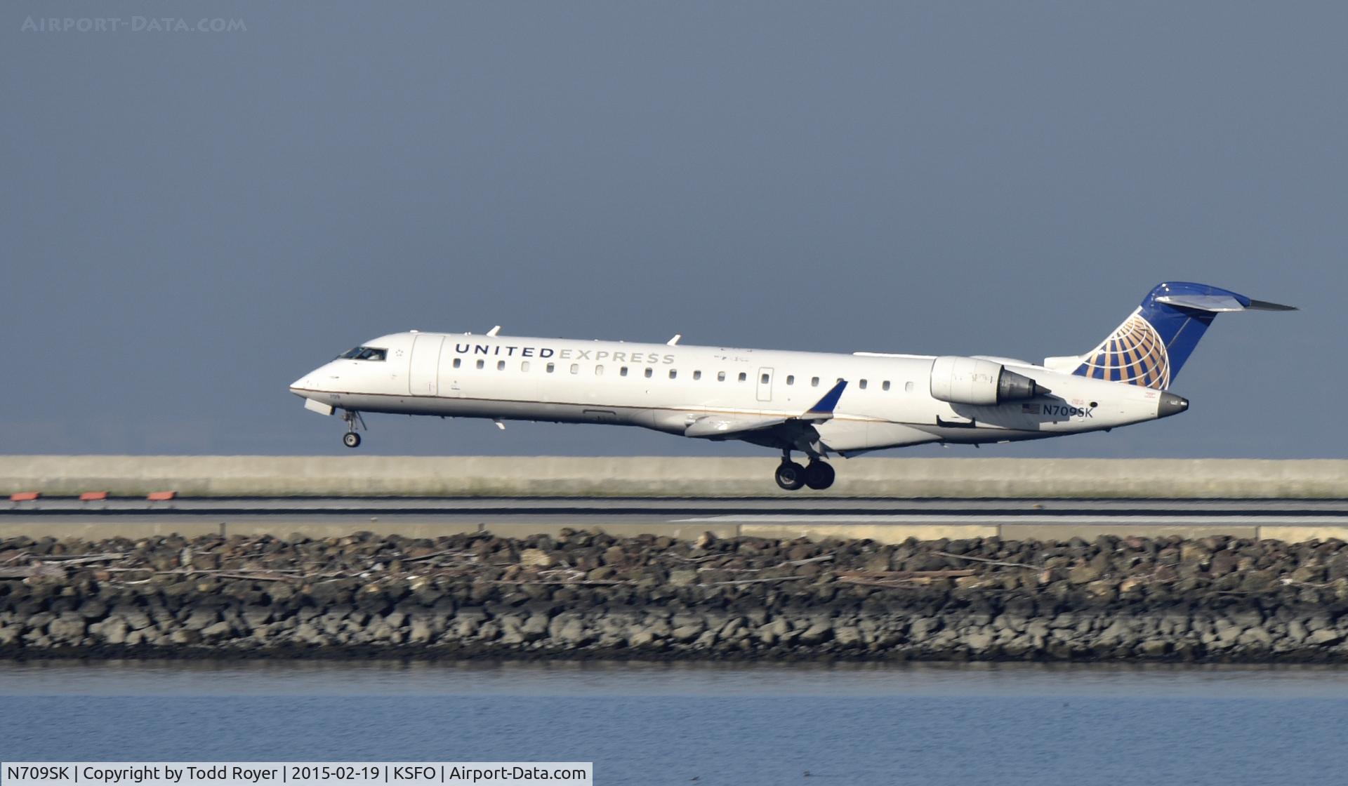 N709SK, 2004 Bombardier CRJ-701ER (CL-600-2C10) Regional Jet C/N 10159, Landing at SFO