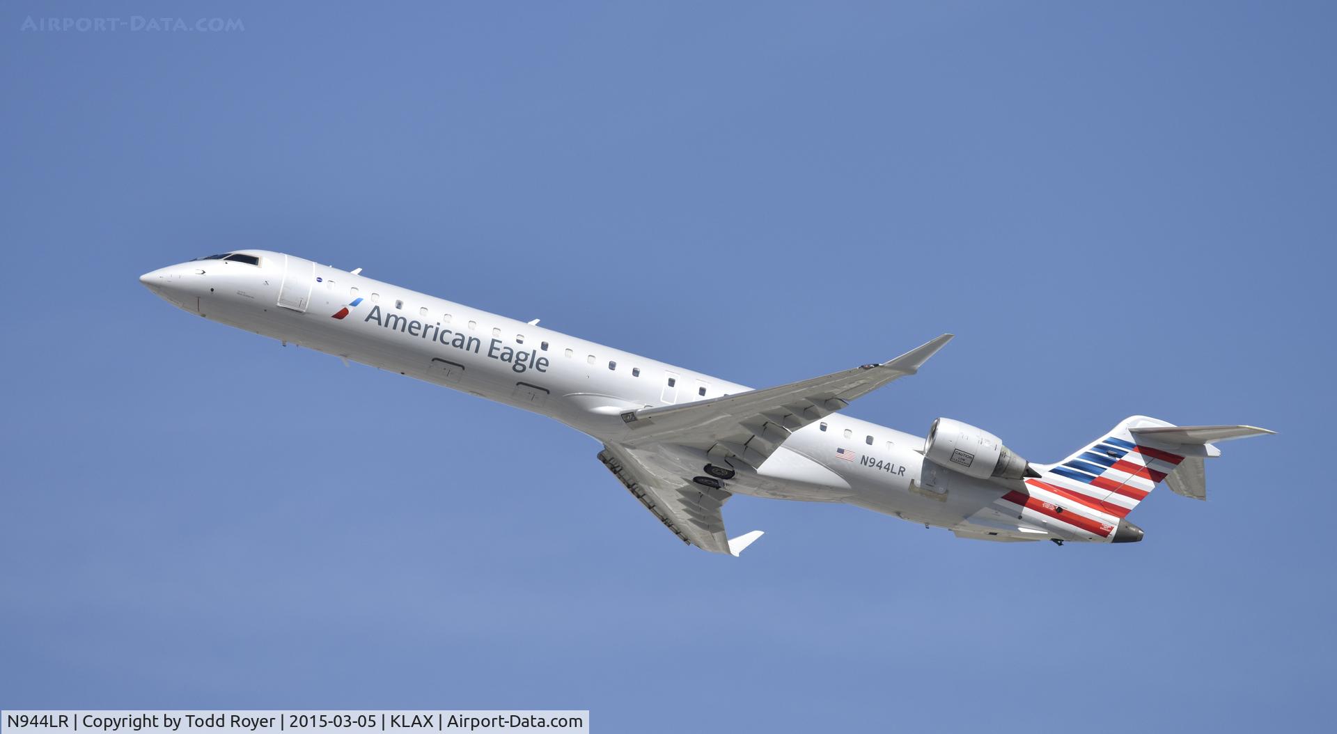 N944LR, 2006 Bombardier CRJ-900ER (CL-600-2D24) C/N 15075, Departing LAX on 25R