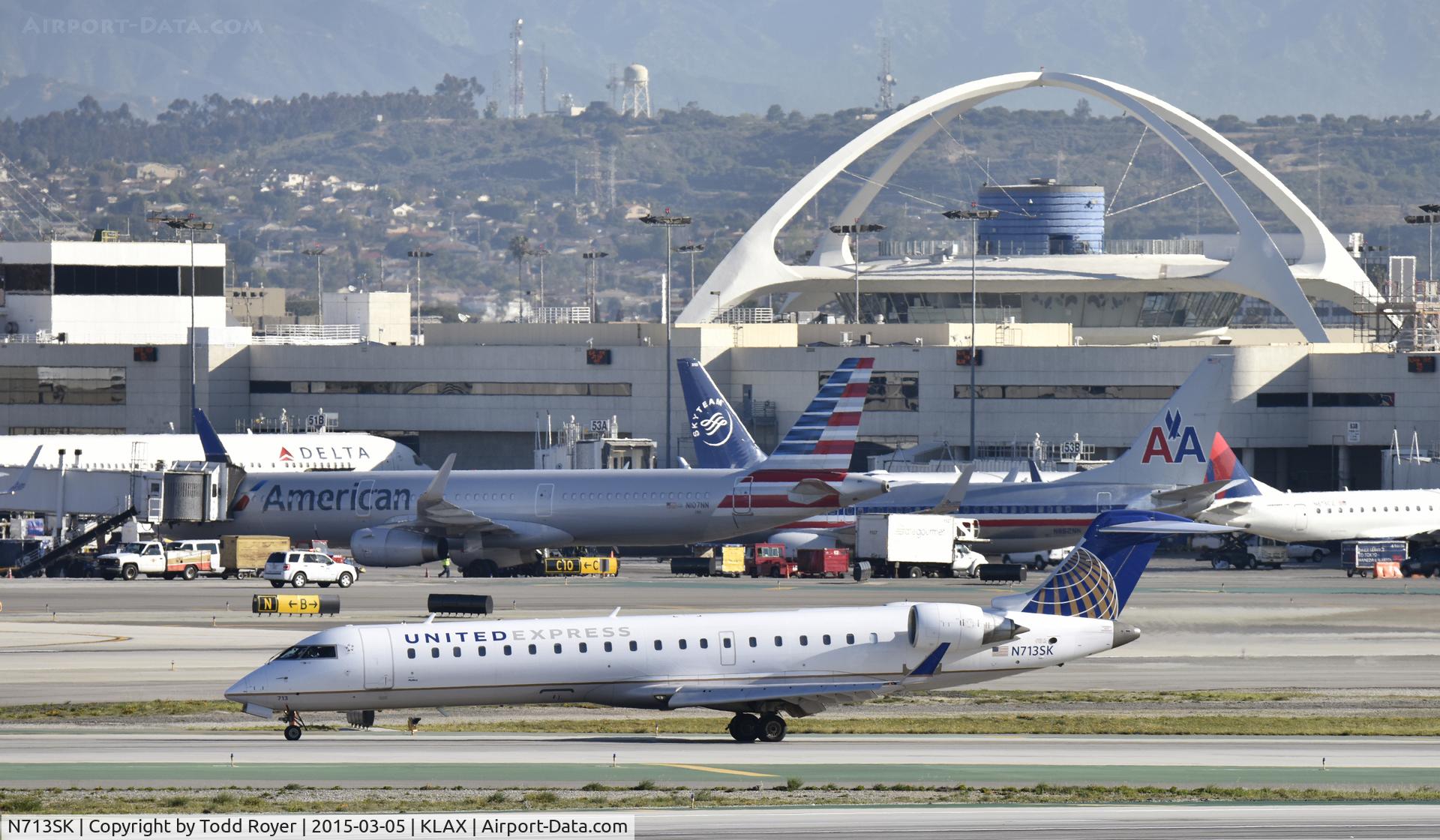 N713SK, 2004 Bombardier CRJ-701ER (CL-600-2C10) Regional Jet C/N 10174, Taxiing to gate at LAX