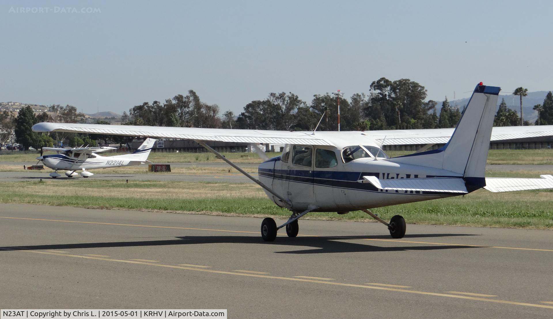 N23AT, 1978 Cessna 172N C/N 17270997, Nice Air's 1978 Cessna 172N taxing down taxiway Z while Trade Wind's Cessna 182T is clear of runway 31R.