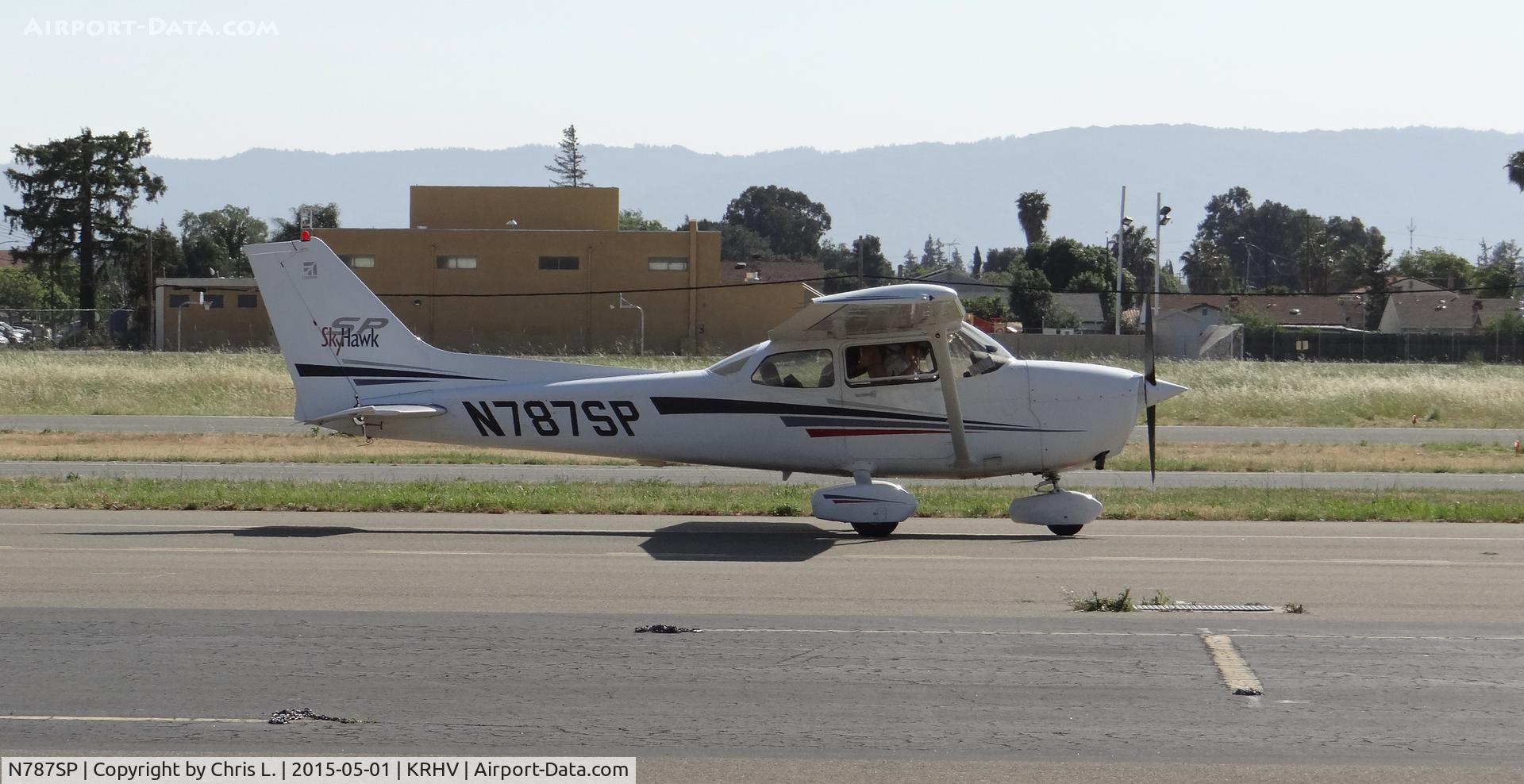 N787SP, 2001 Cessna 172S C/N 172S8714, Trade Wind's 2001 Cessna 172SP taxing back to the hangar with a friendly wave from the instructor.