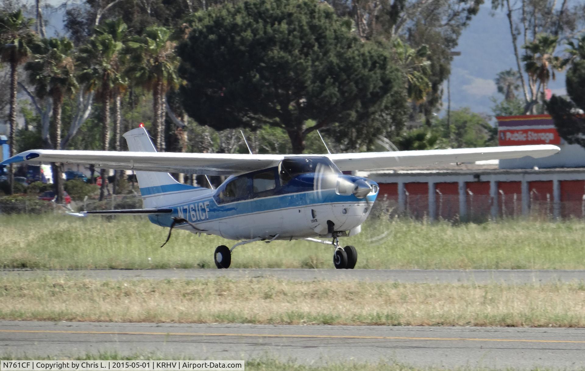N761CF, 1977 Cessna T210M Turbo Centurion C/N 21062144, A transient 1977 Cessna Turbo 210M taking off on runway 31R while a bird decides to join.